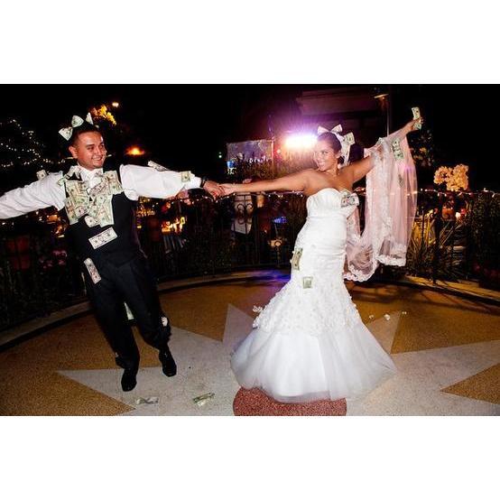 The money dance is a tradition where the guests take turns dancing with the bride and groom. The guests pin money on the clothes of the bride and groom in exchange for a moment to dance with them.