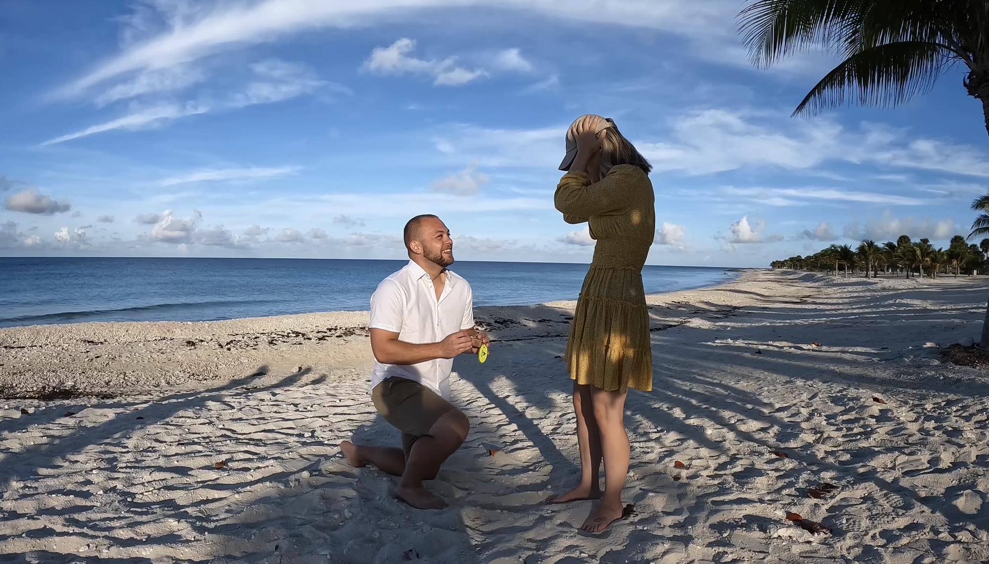 November 2nd, 2022 - On the last day of our cruise, Gage popped the question at sunrise. He secretly brought Emma’s dad’s hat on the trip so he could be a part of this moment as well.