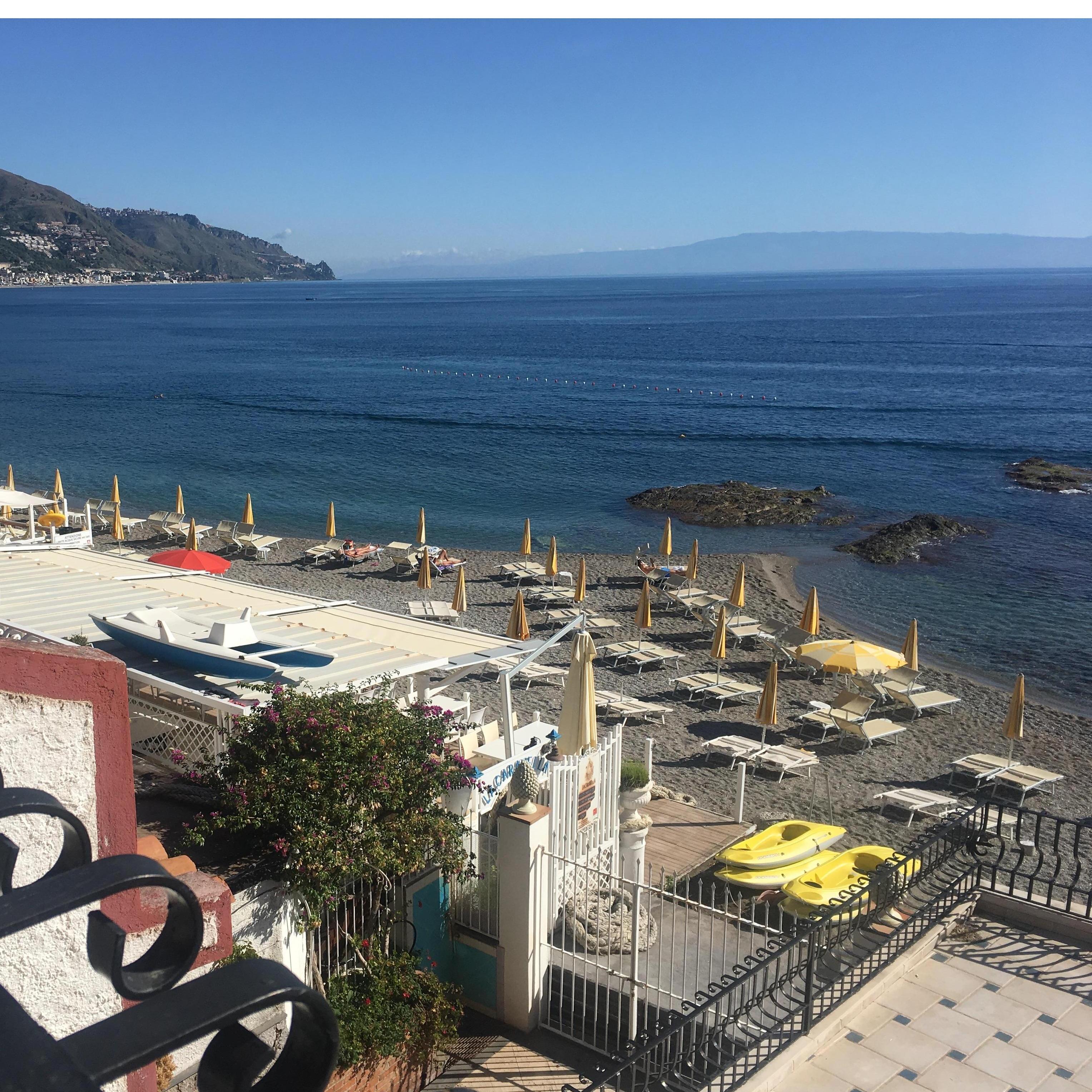 The beach, in Taormina, Sicily, Italy where John proposed