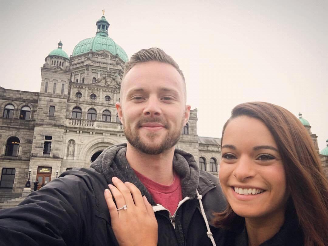 Celebrating our engagement taking pictures at the Victoria, BC capitol building