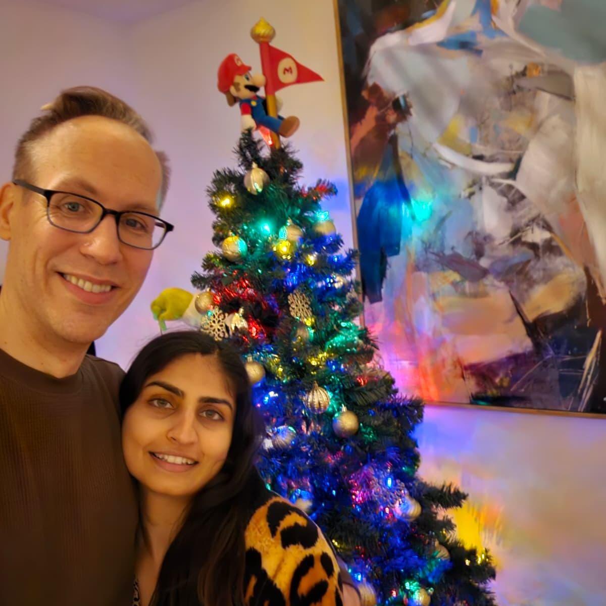 Our first Christmas together. What the photo doesn't show is the wreath we both made together :)