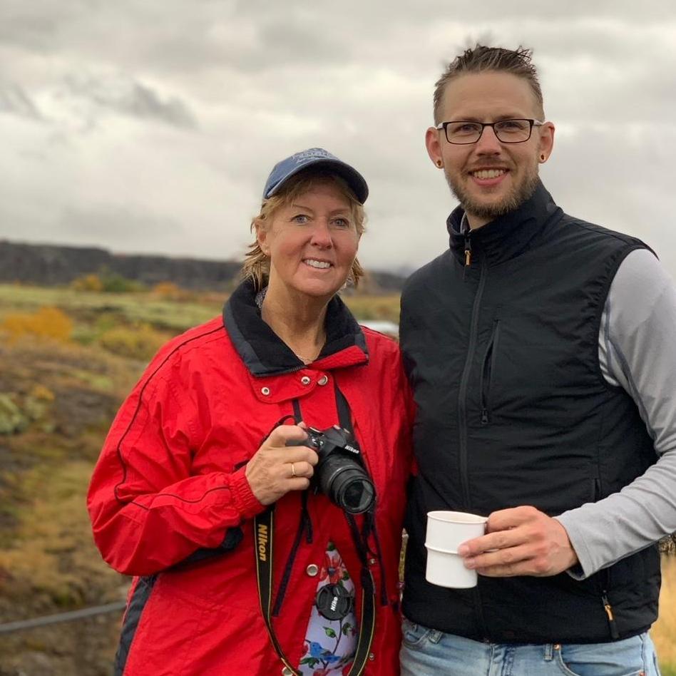 Justin and Sharon, warming up with some hot cocoa after snorkeling over the tectonic plates in freezing water in Iceland!