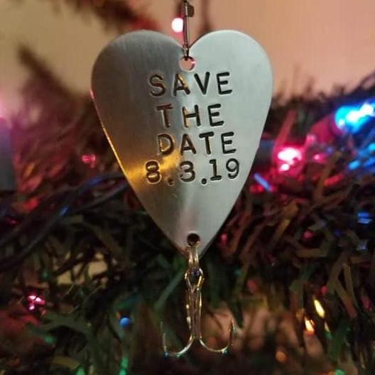 Niles' save the date fishing lure that he put on his Christmas tree.