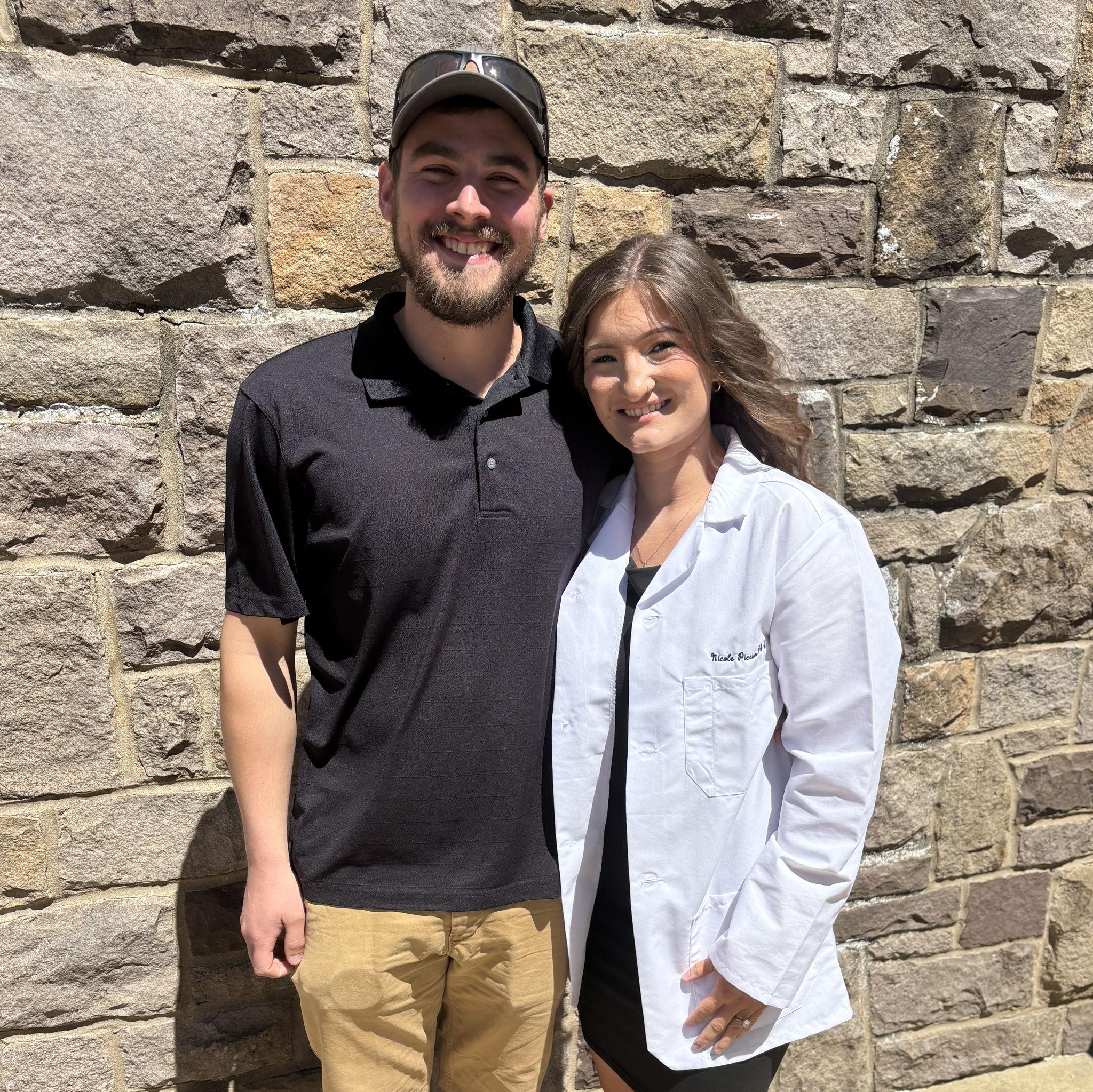 Cam being my #1 cheerleader at my white coat ceremony