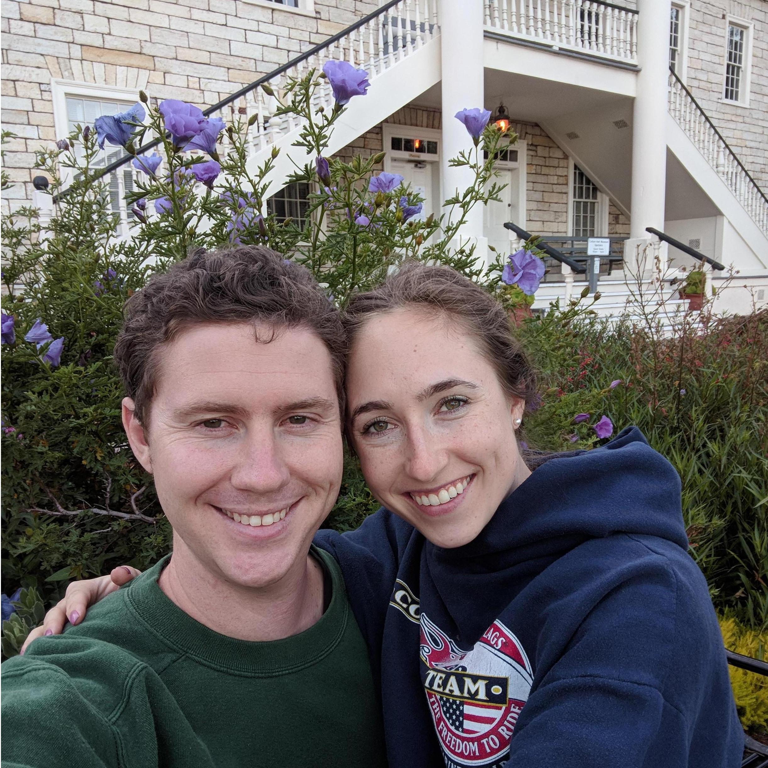 I like to take pictures in front of flowers. Andrew appeases me.