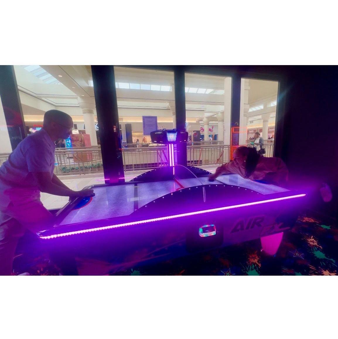 Arcade date, where Safiyyah definitely beat Abdul at air hockey… or so she says.