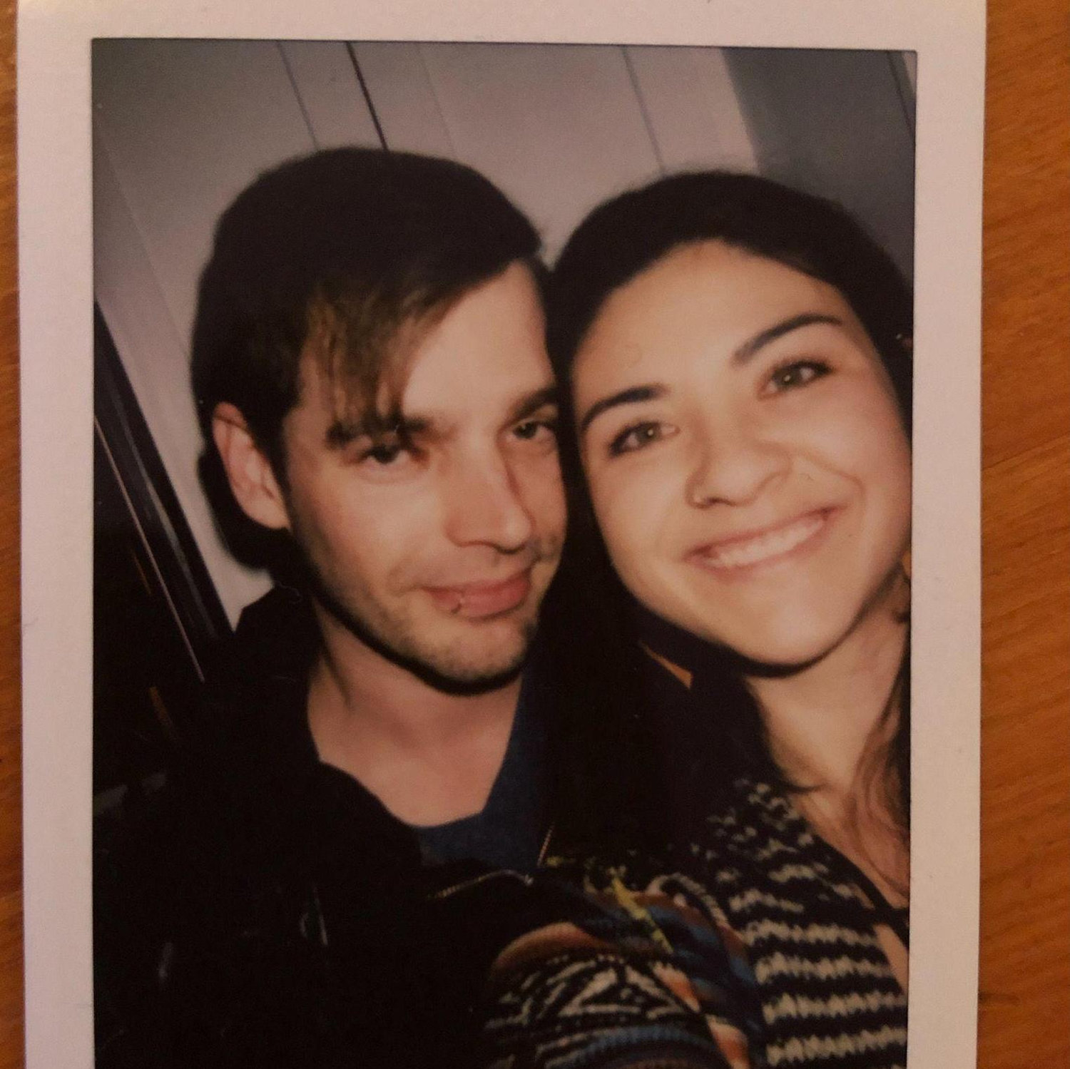 The first photo as an official couple snapped on a polaroid at a friend's get together, 2022.