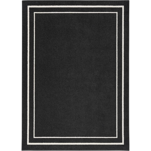 Nourison Essentials Solid Bordered Low Pile Indoor Outdoor Area Rug 5' x 7' Black Ivory