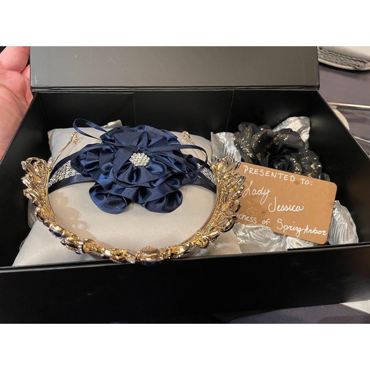 Each Duchess recieved their own crown from the Queen. Each crown has Laurentium's signature jewel the Blue Sapphire