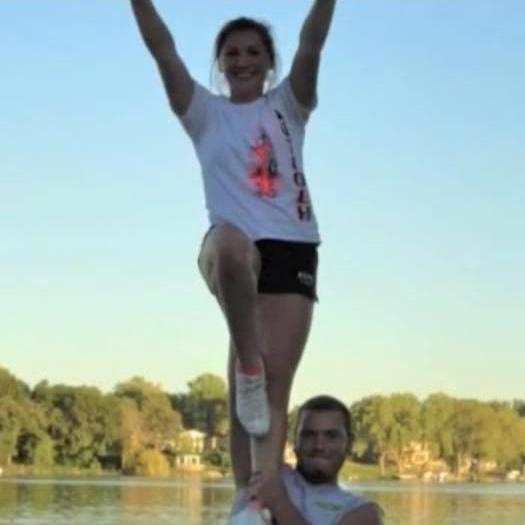 Football and Cheer stunting for senior homecoming 2013