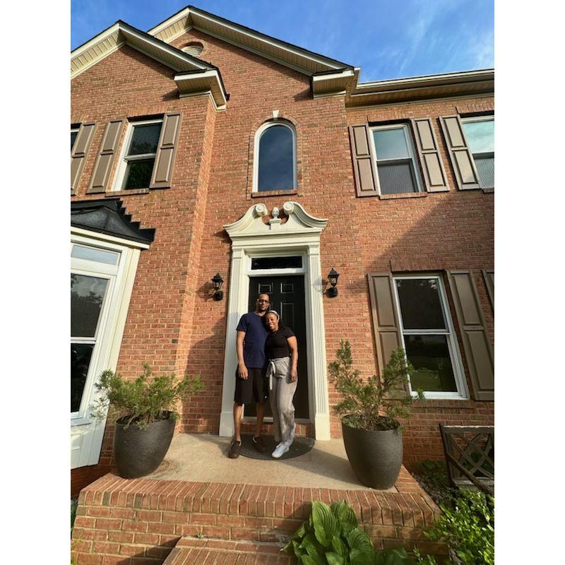 Our first picture in front of our new home together!