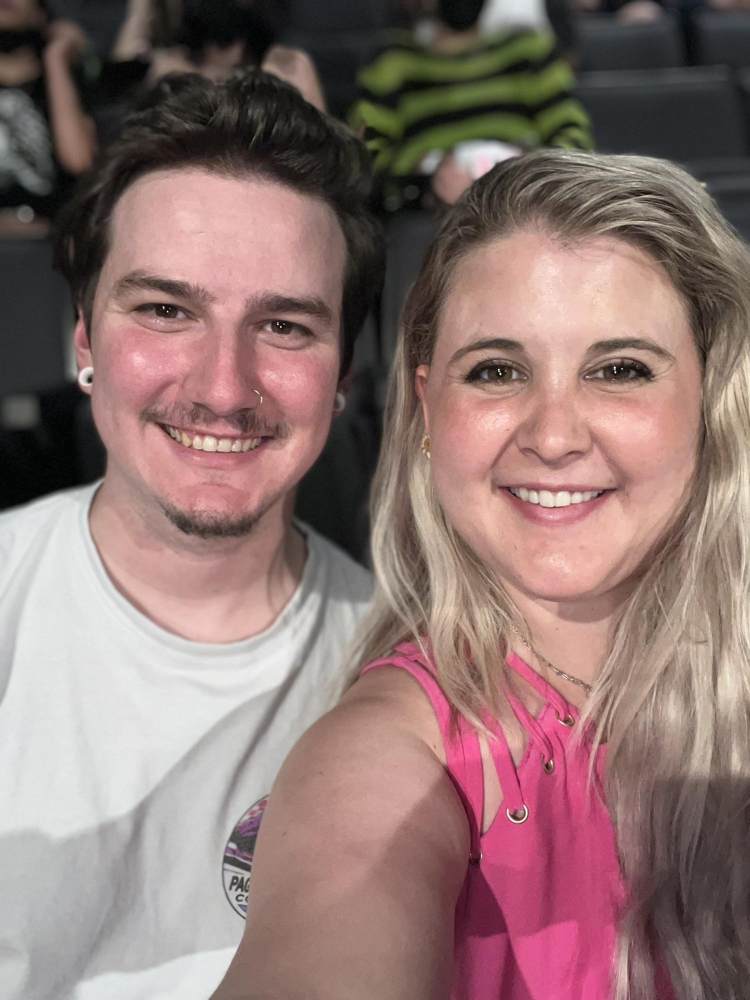At a KPOP concert!! We love going to concerts. Concerts have always been a big part of our date nights! Bradley is extremely passionate about music and says that it's even better shared together!