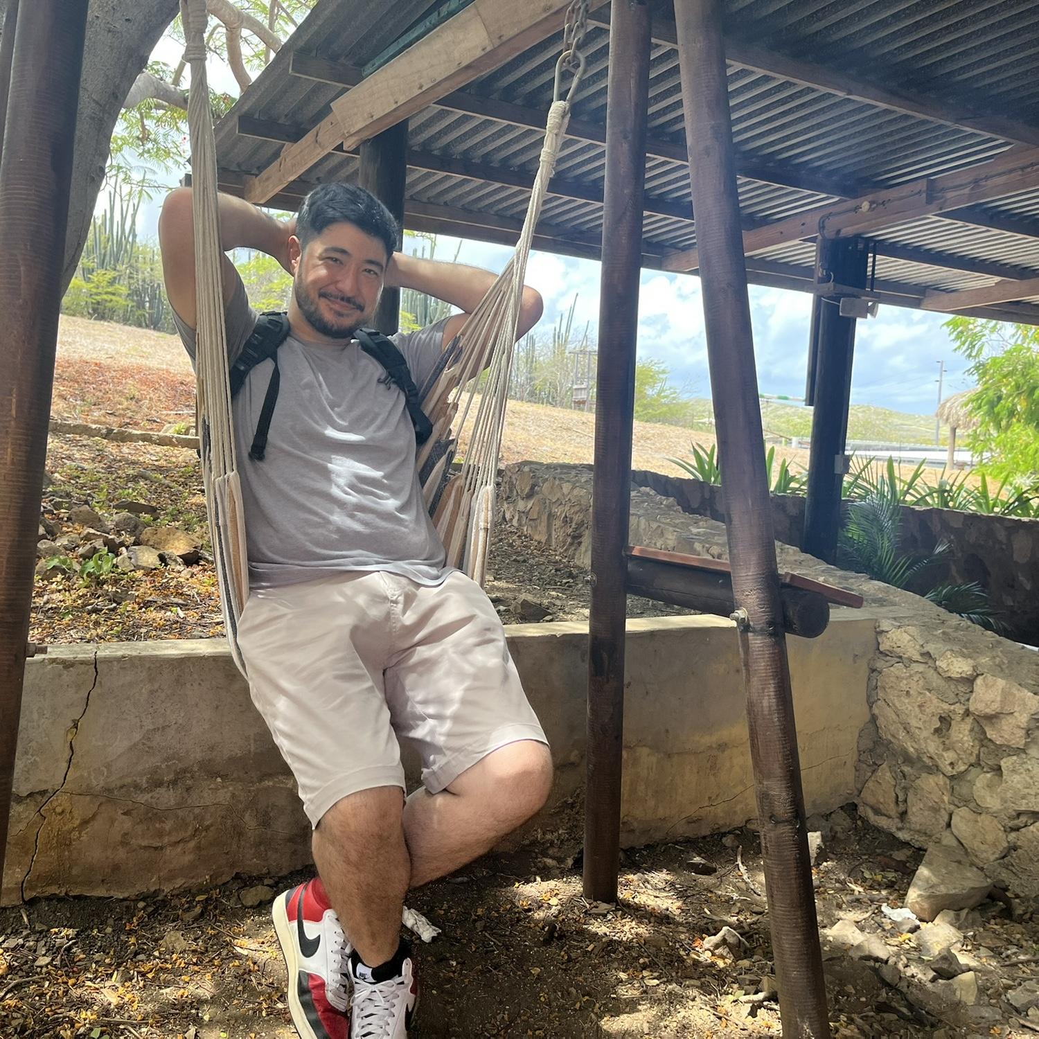 Adam chilling on a swing hammock in Curaçao