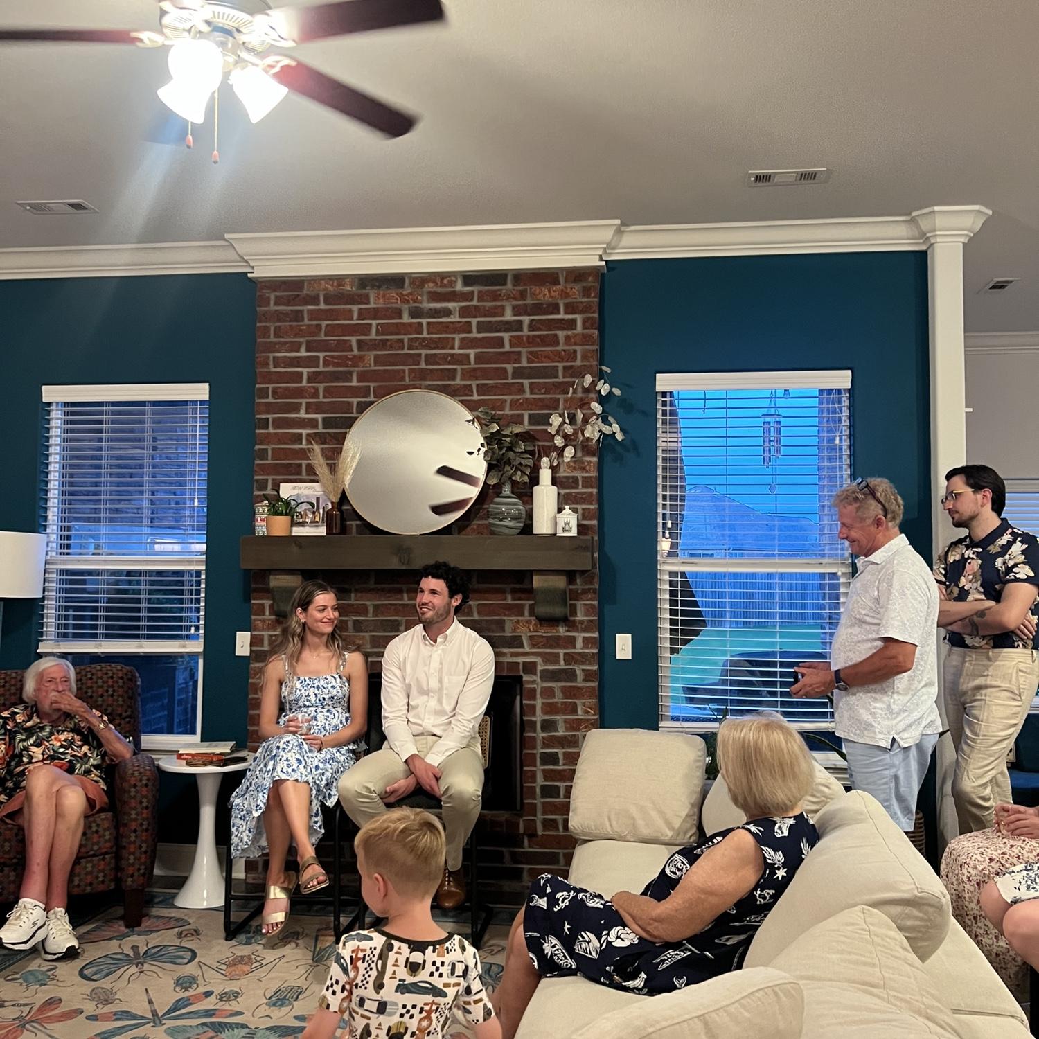 7/18/2025- Photo of Merrick sharing the proposal story at our engagement party at his sisters house in Springdale, Arkansas.