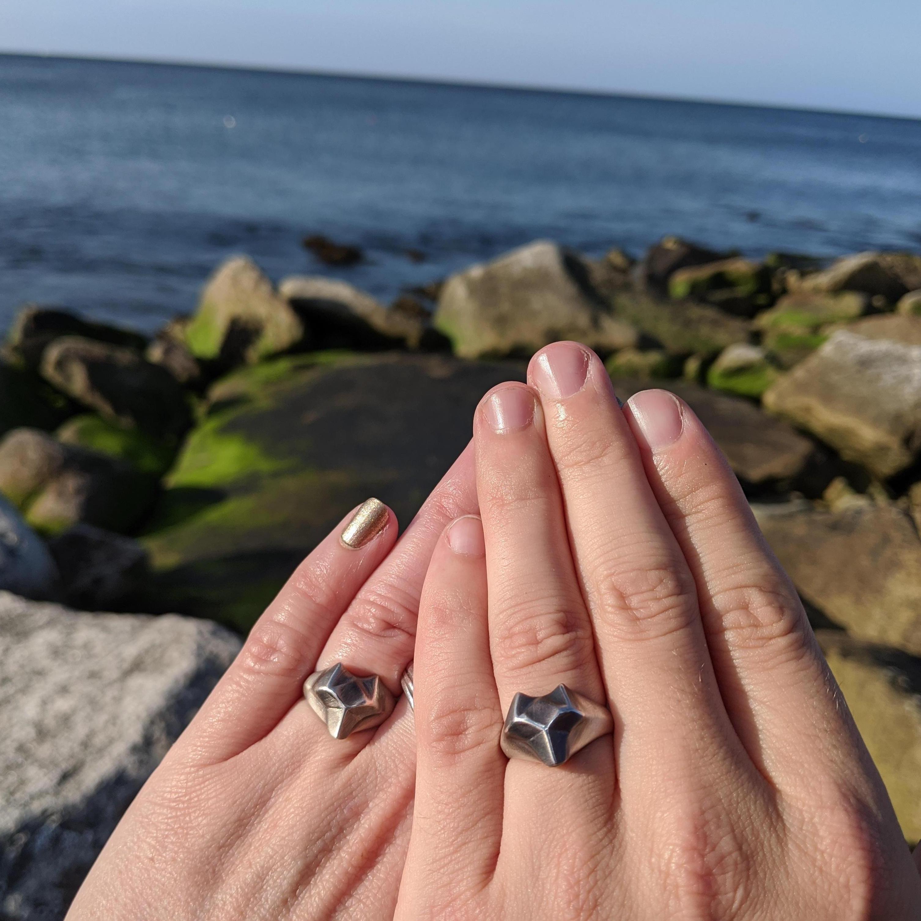 Classic engagement ring picture, with not so classic rings.