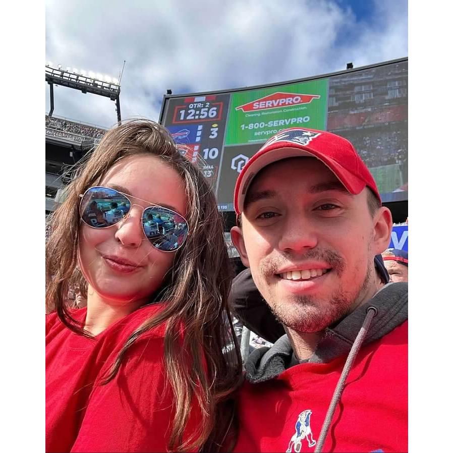 Maddie and Austin at a Patriots game for Austins birthday