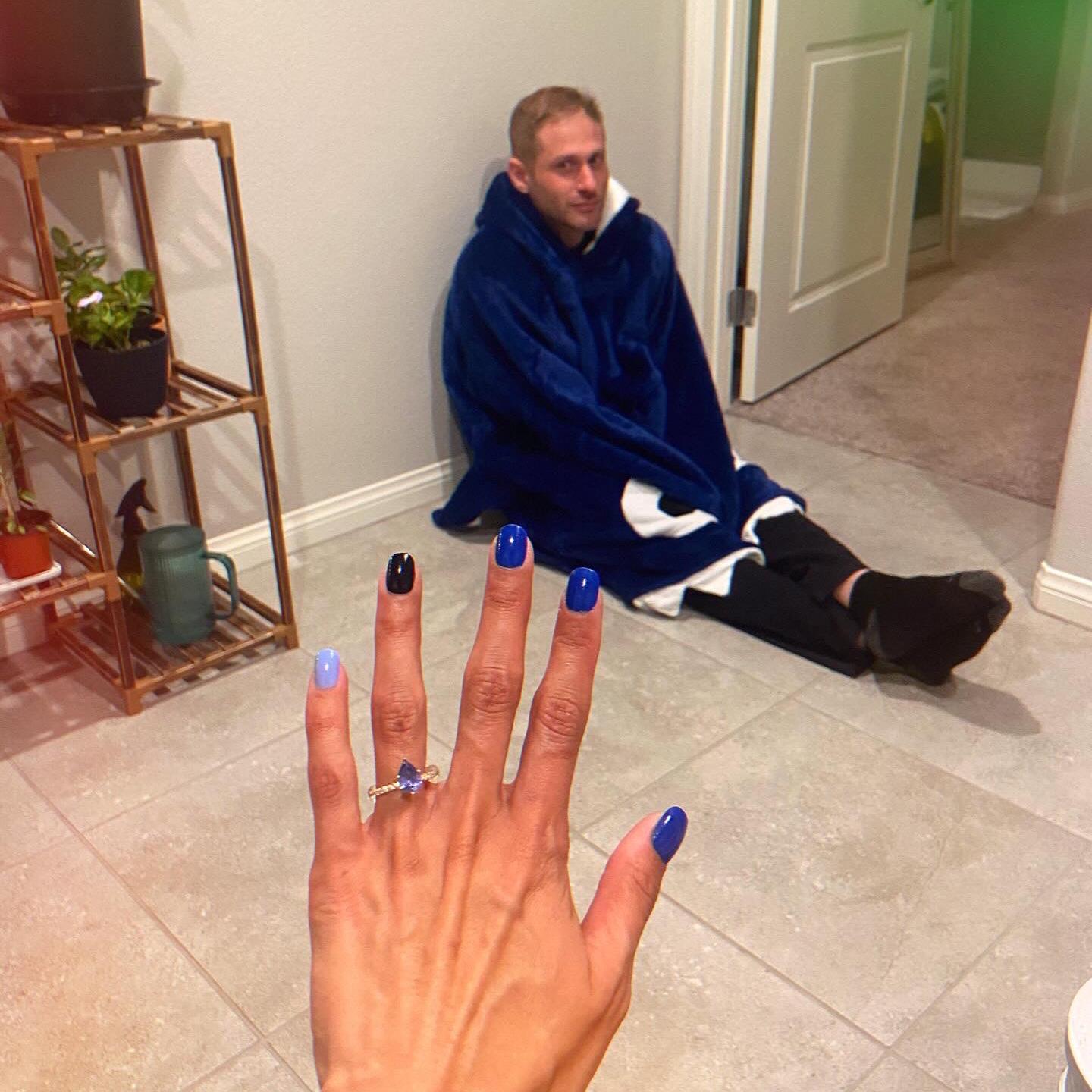 The night of the proposal. Chanoa wanted to show off the ring. Justin exhausted in his shark snuggie after months of planning.