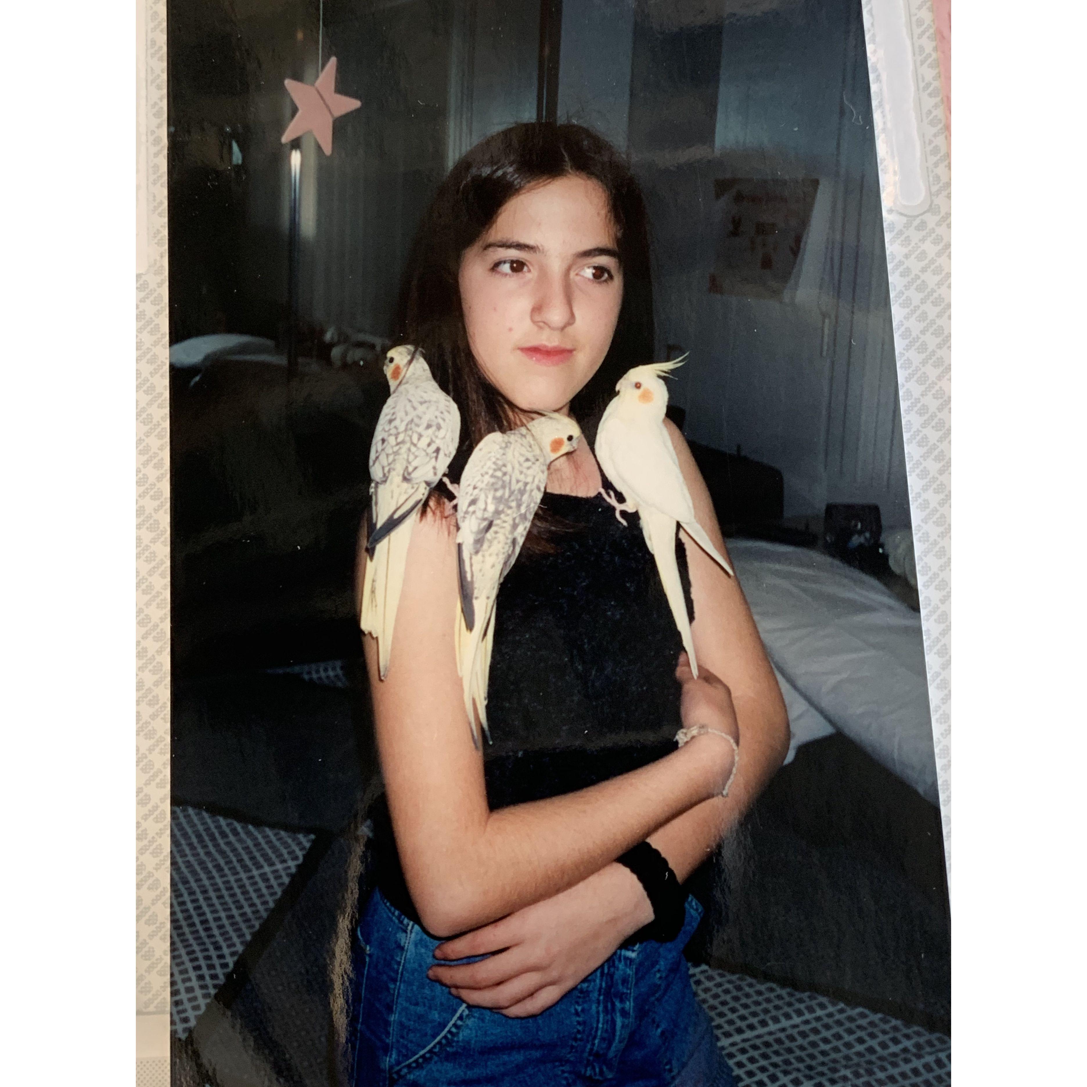 1999 Los Angeles Nicolle with her pet cockatiels.
