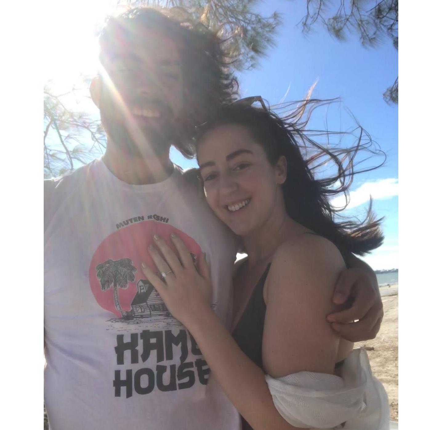 We smushed my phone into a tree to take this pic. We're newly engaged here!