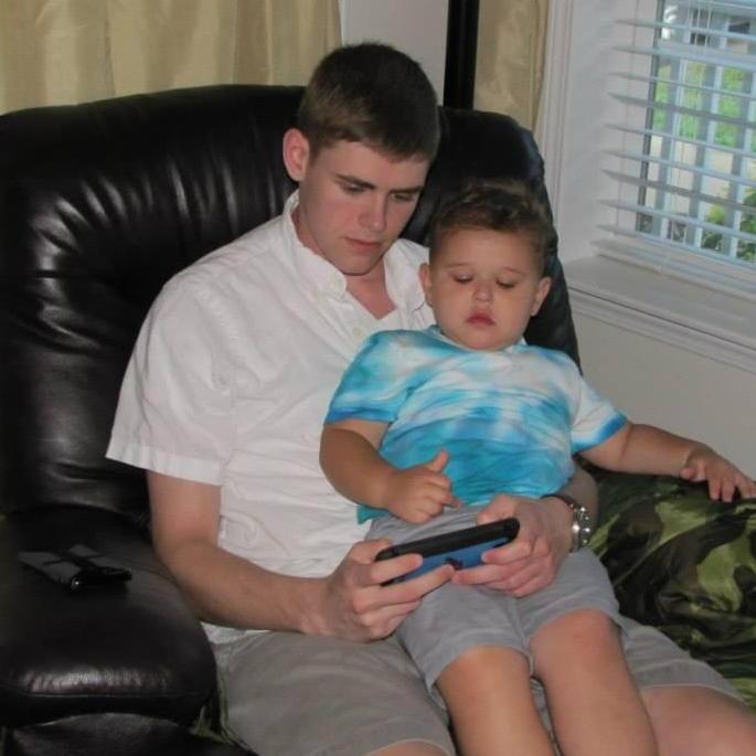 Wyatt teaching Casey how to play the game.