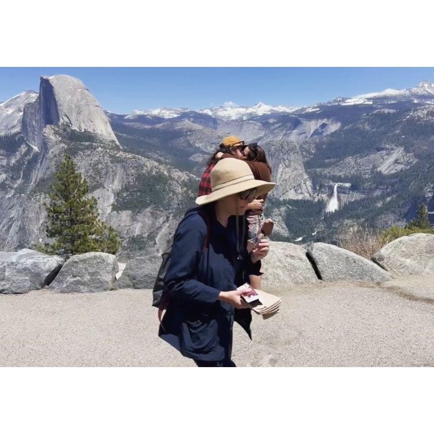 Photobombing tourist during Michael's proposal - they're really enjoying their ice cream