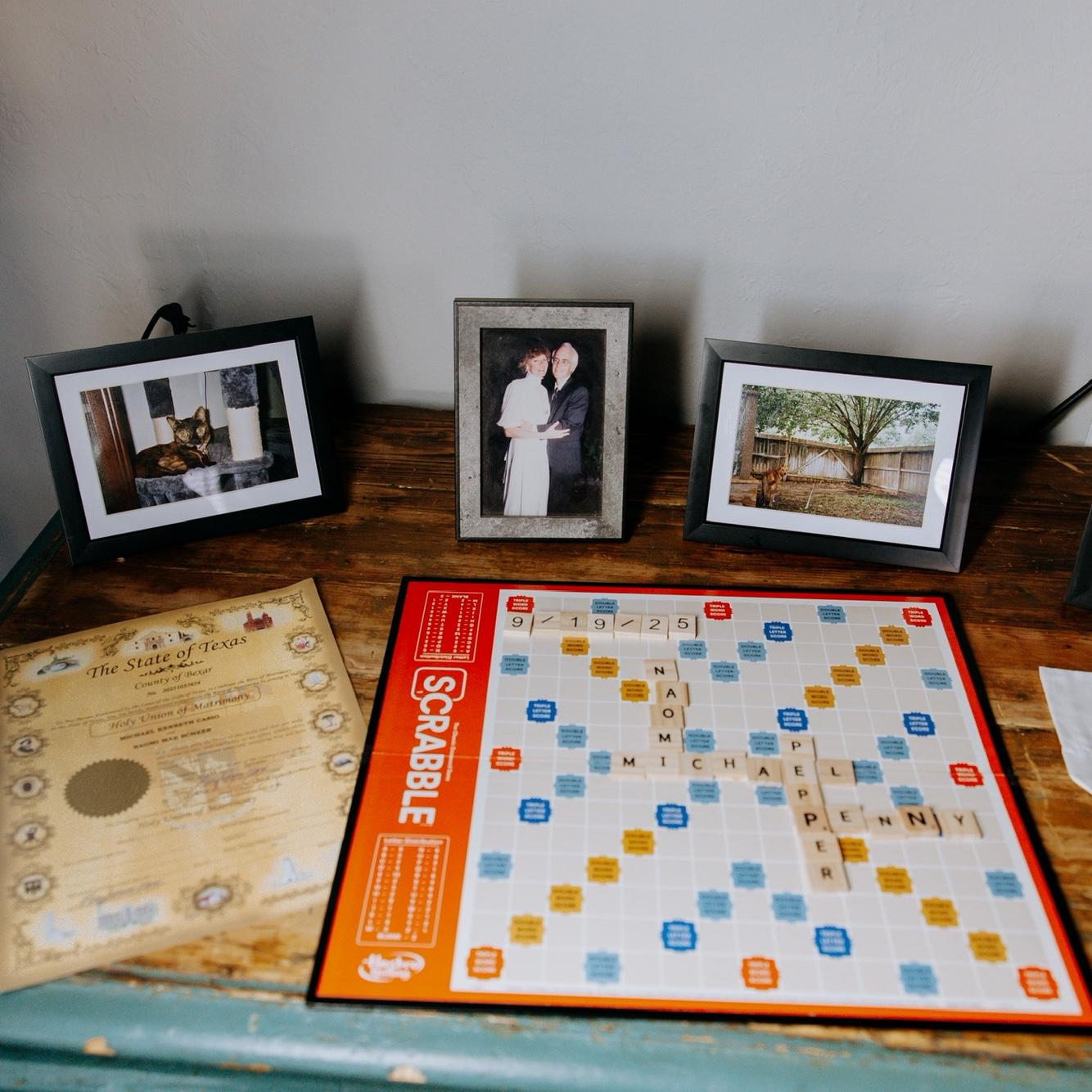 Our little spread in the hotel - pictures of Penny, Grandpa Jim/Grandma Pat, along with our marriage license/scrabble with our names!
