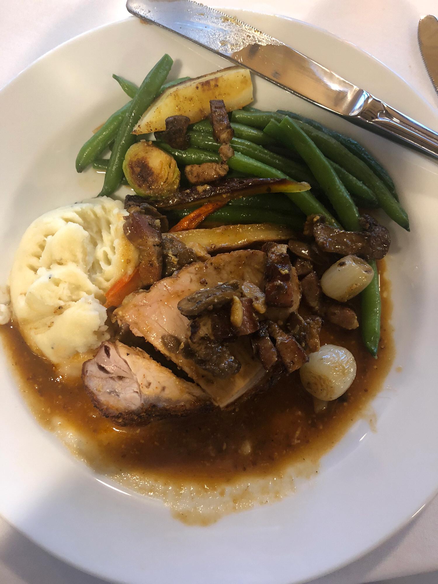 Fresh Herb Crusted Pork Loin:
Topped with mushrooms, pearl onions, & rosemary-roasted garlic clove sauce with white cheddar mashed potatoes and green beans
(sorry I took the picture after I ate some)