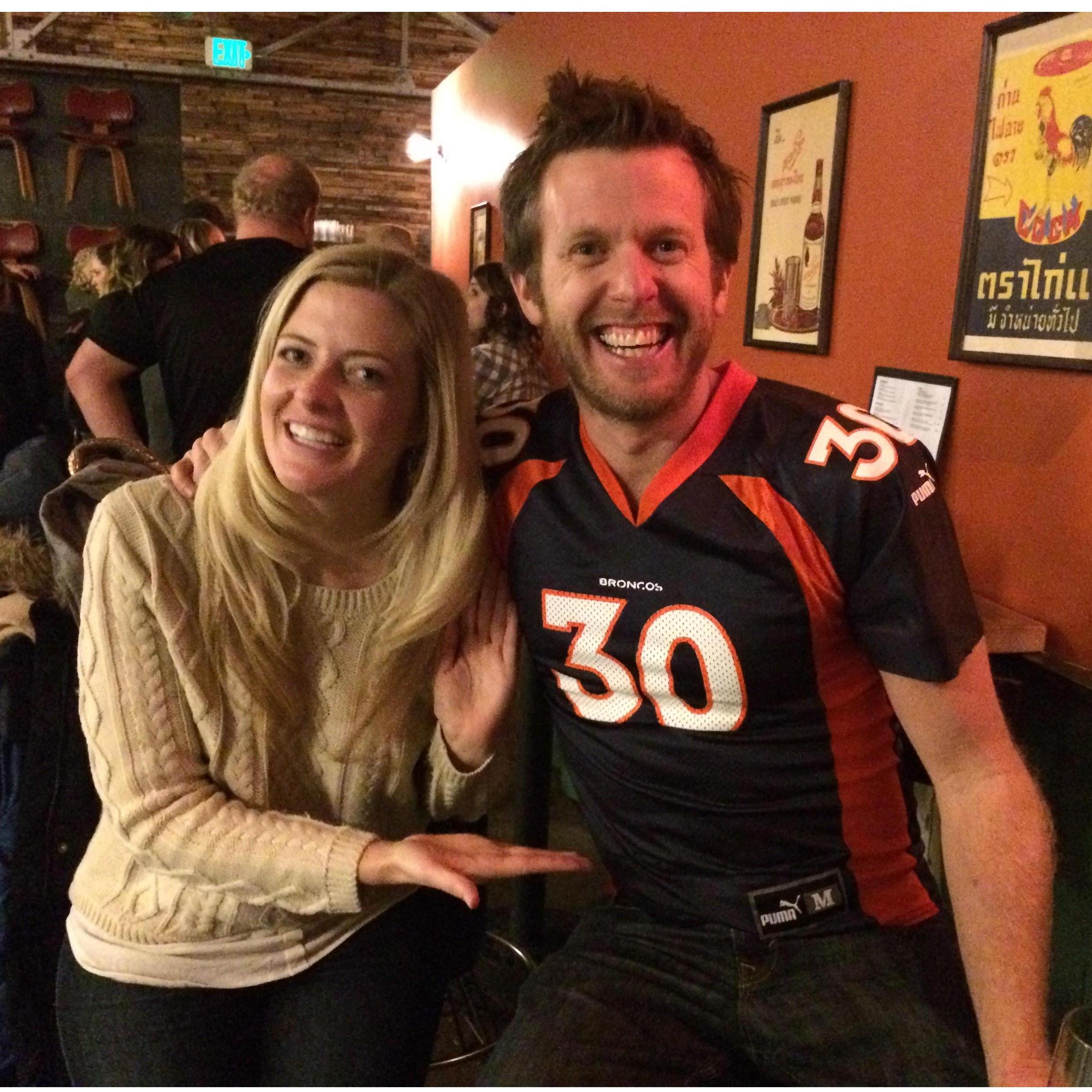 When the Bengals lost to the Broncos in 2015, Kelly lost a bet. What did he have to do? Wear Bri's old Terrell Davis jersey, which was a bit tight.