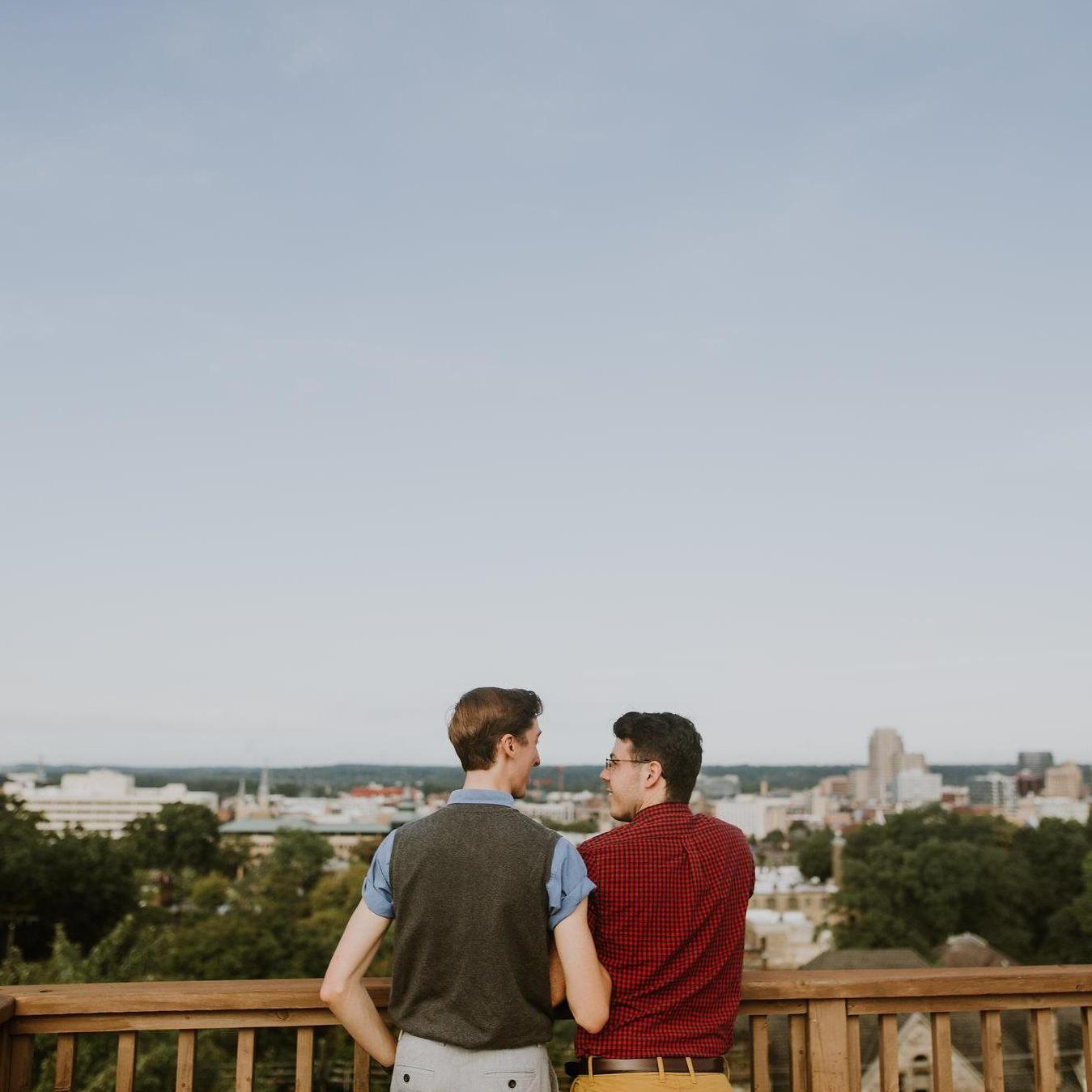 This photo was taken on top of the rooftop deck upon the purchase of the condominium at Hillmount. The couple is looking out over Grand Rapids, MI.
Photo by Sarah Pyper Photography