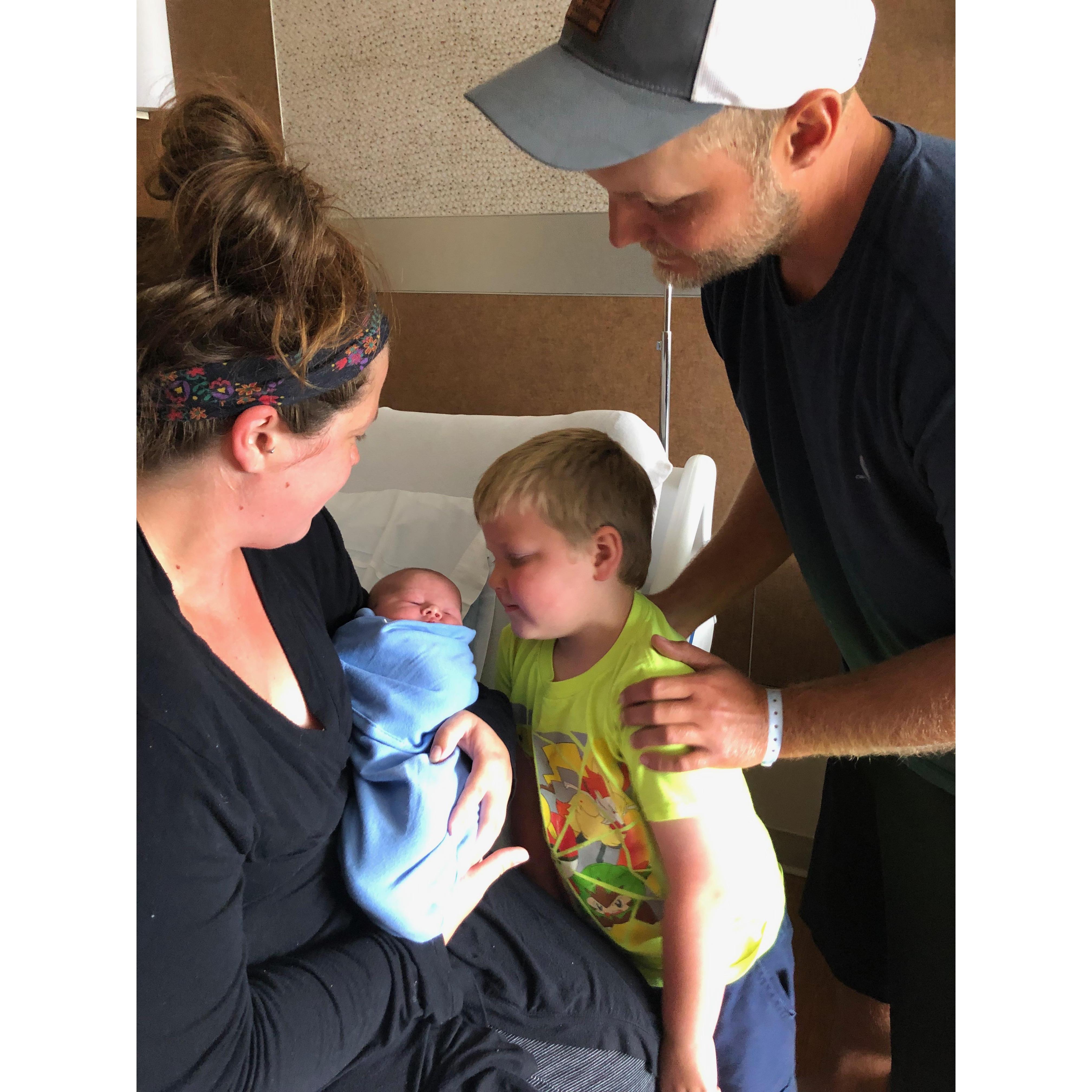 First family photo of four.