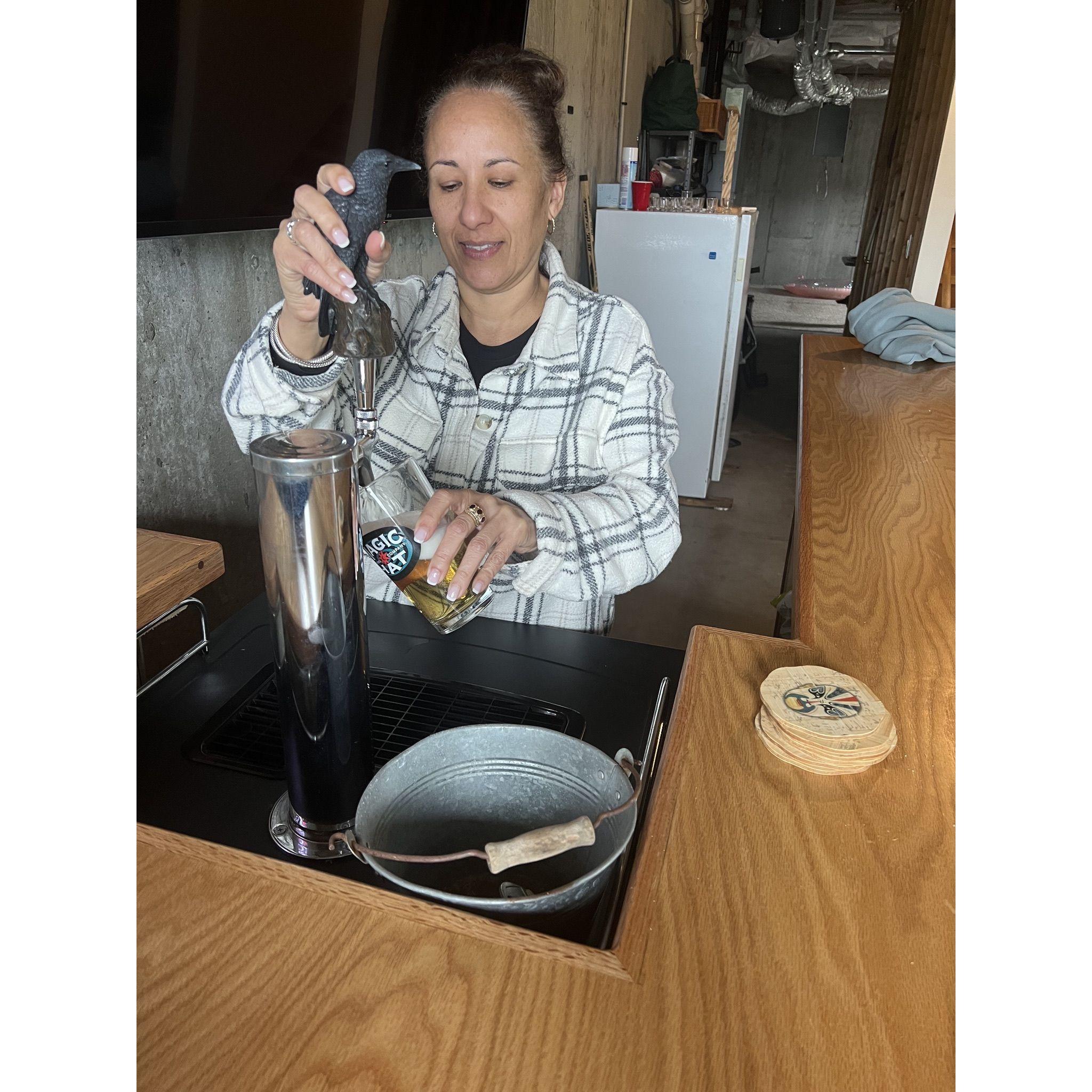 Friend Jackie Miranda pouring a pint at O'Milmoe's