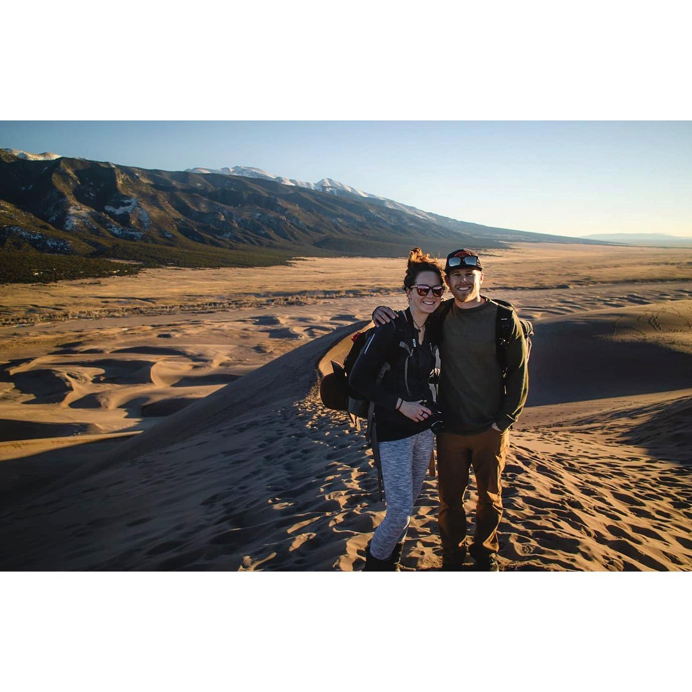 Climbing sand dunes in Colorado
