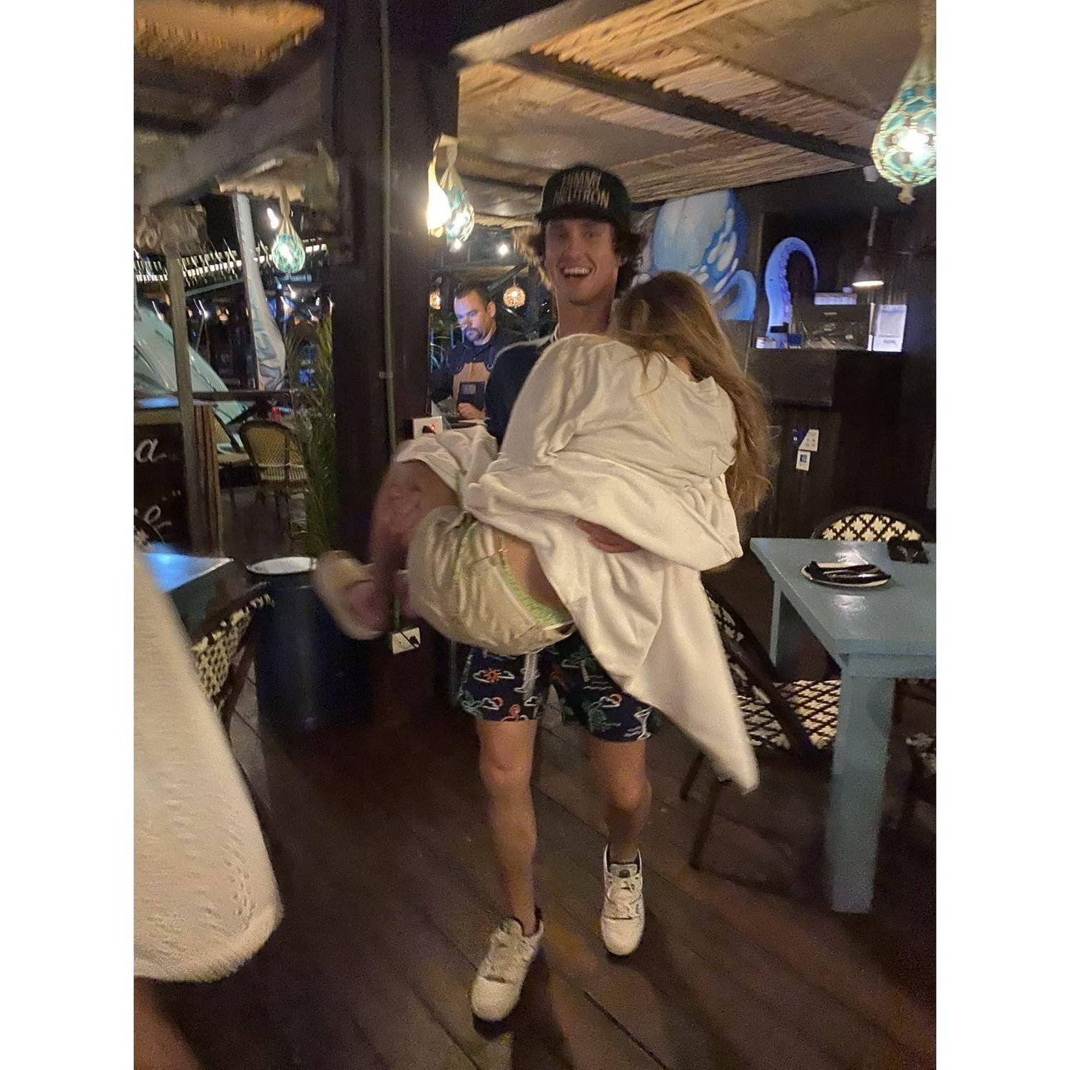 Bo carrying Kendyl from dinner in Mexico with his family