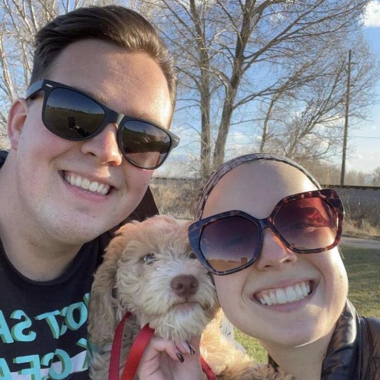 A picture of us with Charlie, a puppy that we took care of during Spring Break 21. He was a rascal, but we love him.