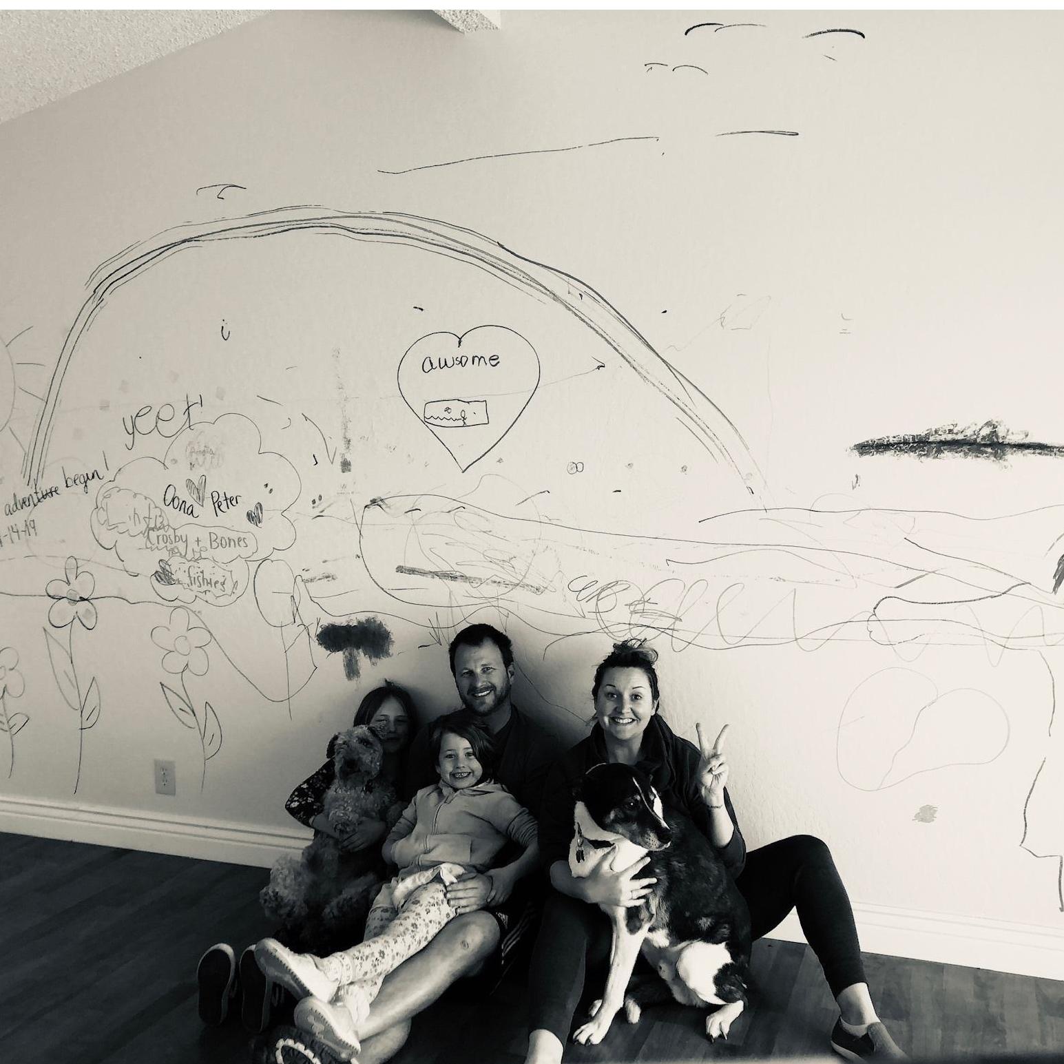 Family photo before we completely demolished the wall and started our home renovation!