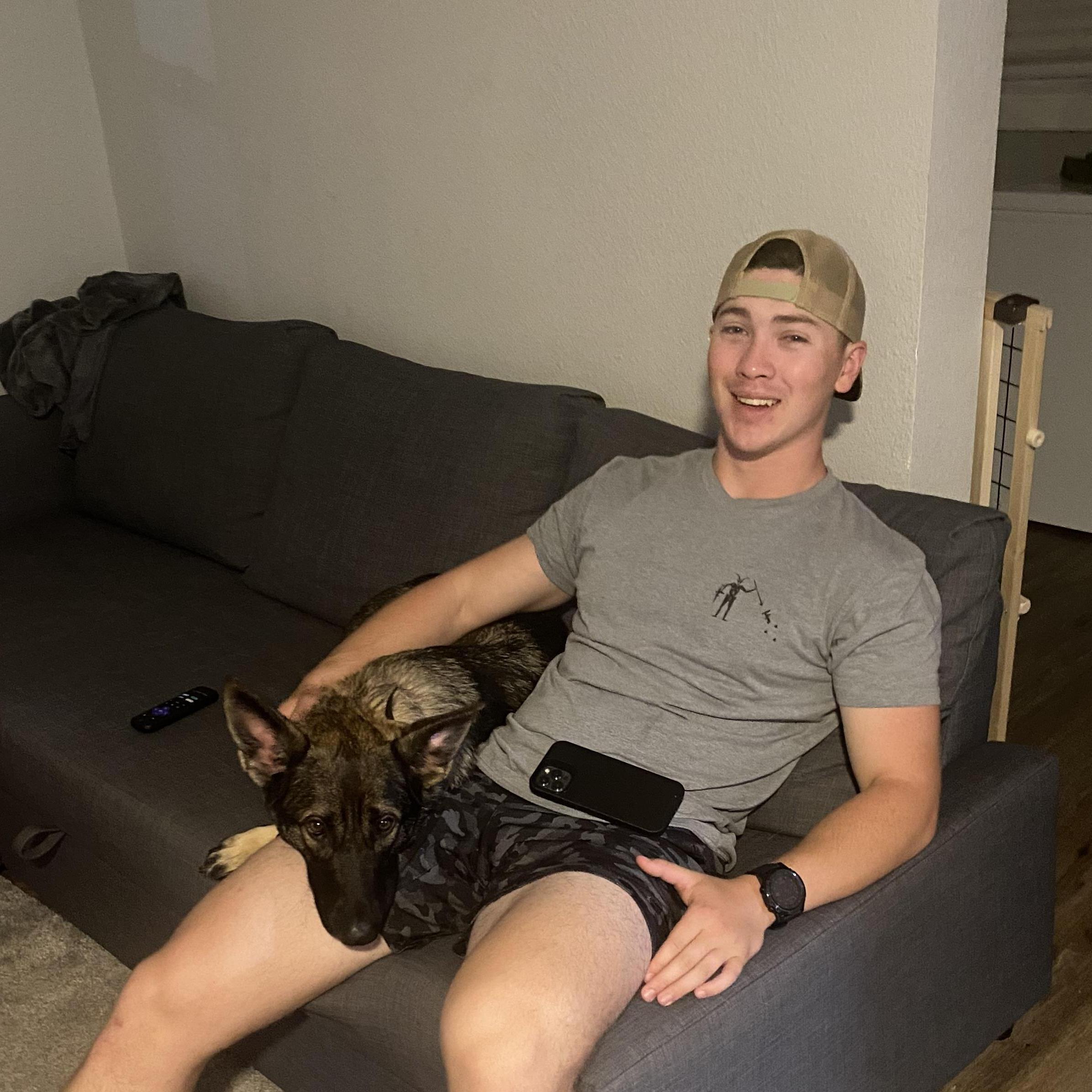 Kade and our cute pup Zora, 2021