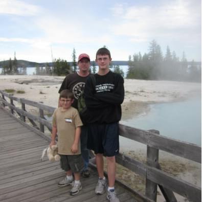 Quinton with his dad and bother at Yellowstone National Park (2010)