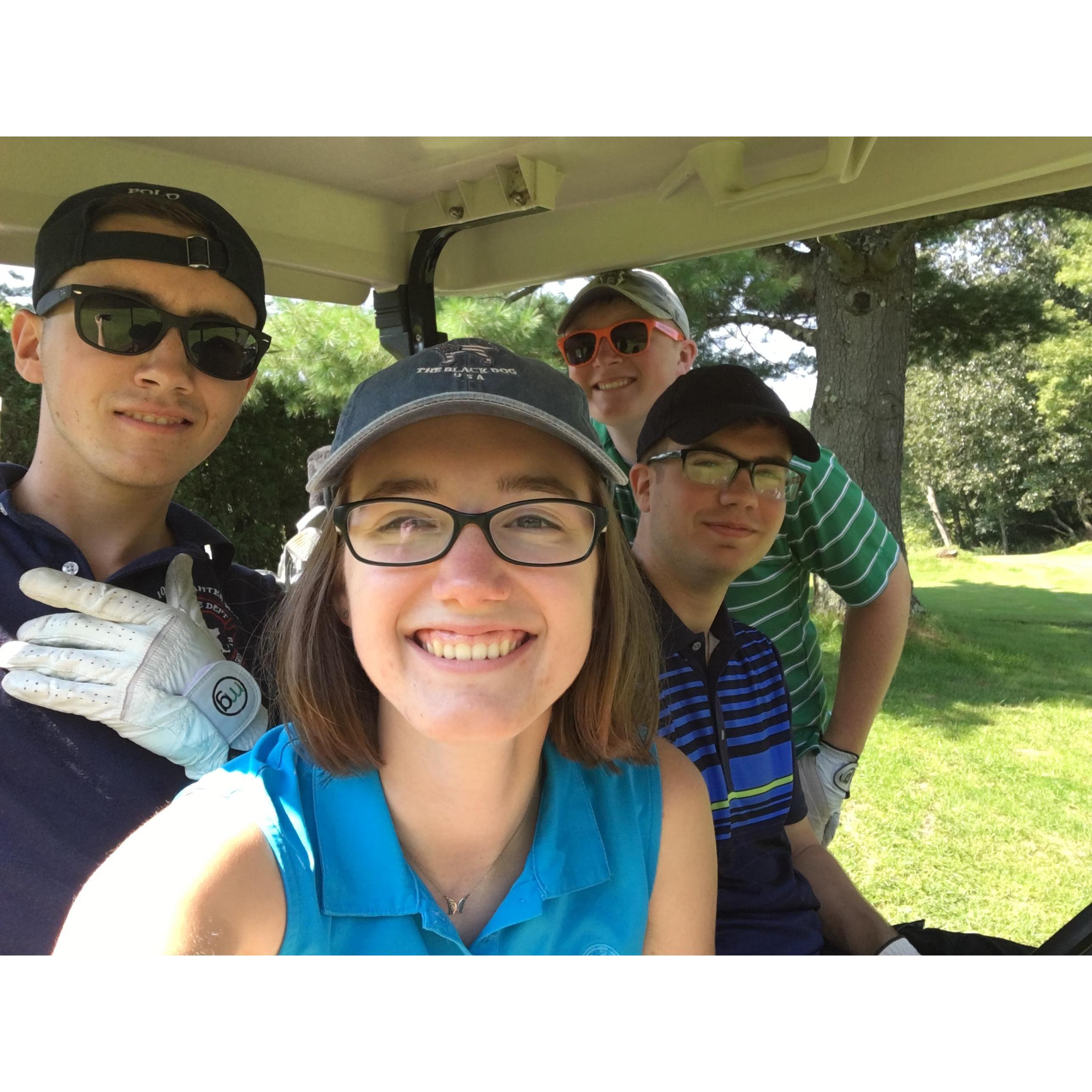 This is at a golf tournament Jessica's dad runs (and those are her brothers) - we like to pretend we know how to play