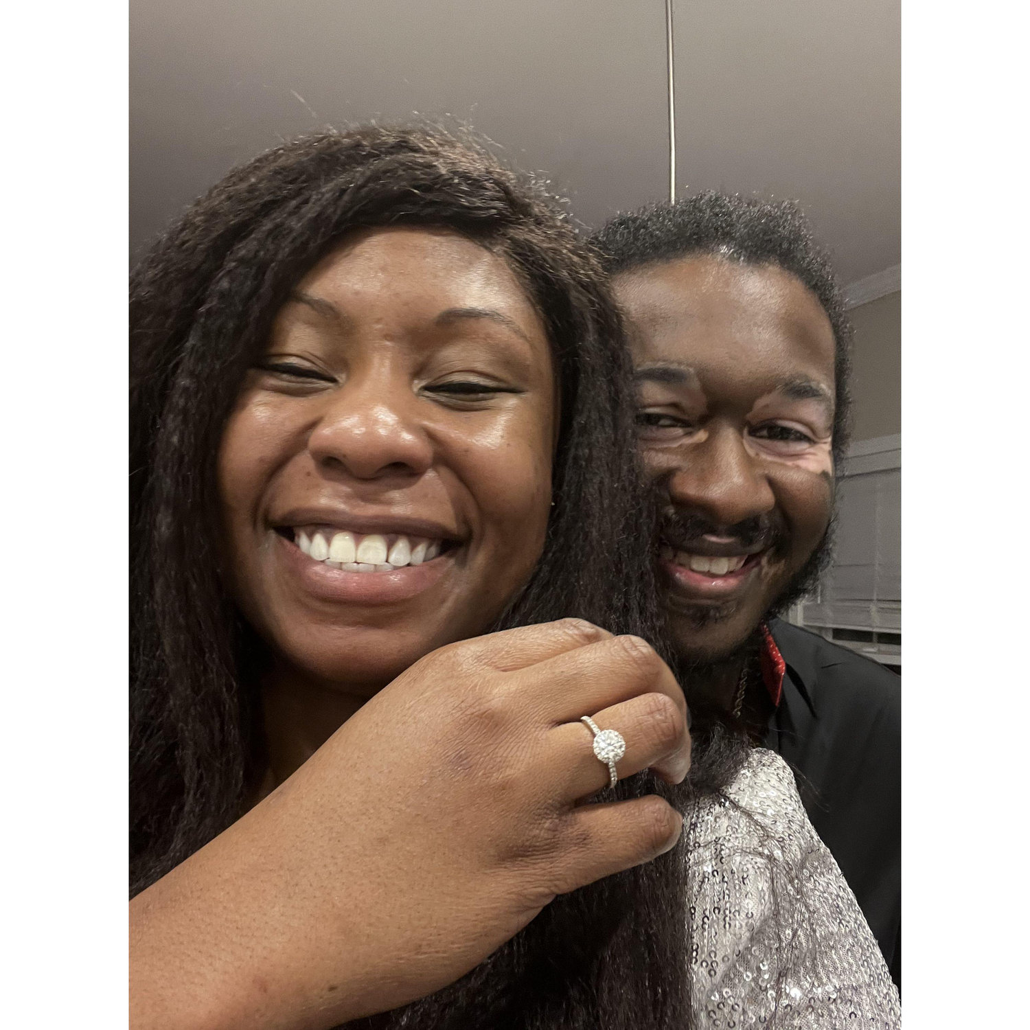 He had just proposed. I was so excited I put the ring on the wrong finger!! lol