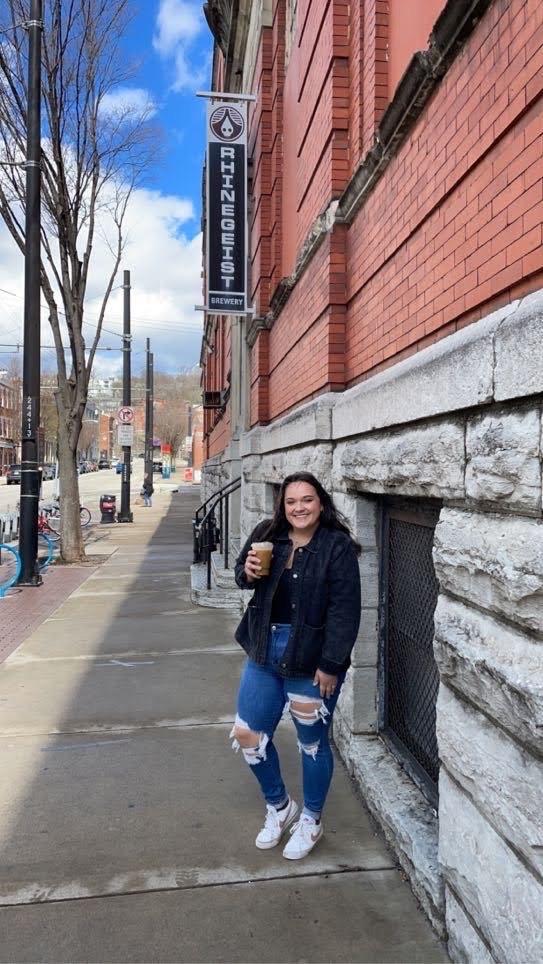 Here’s a picture of Laura before we toured Rhinegeist and fell IN LOVE with the space!