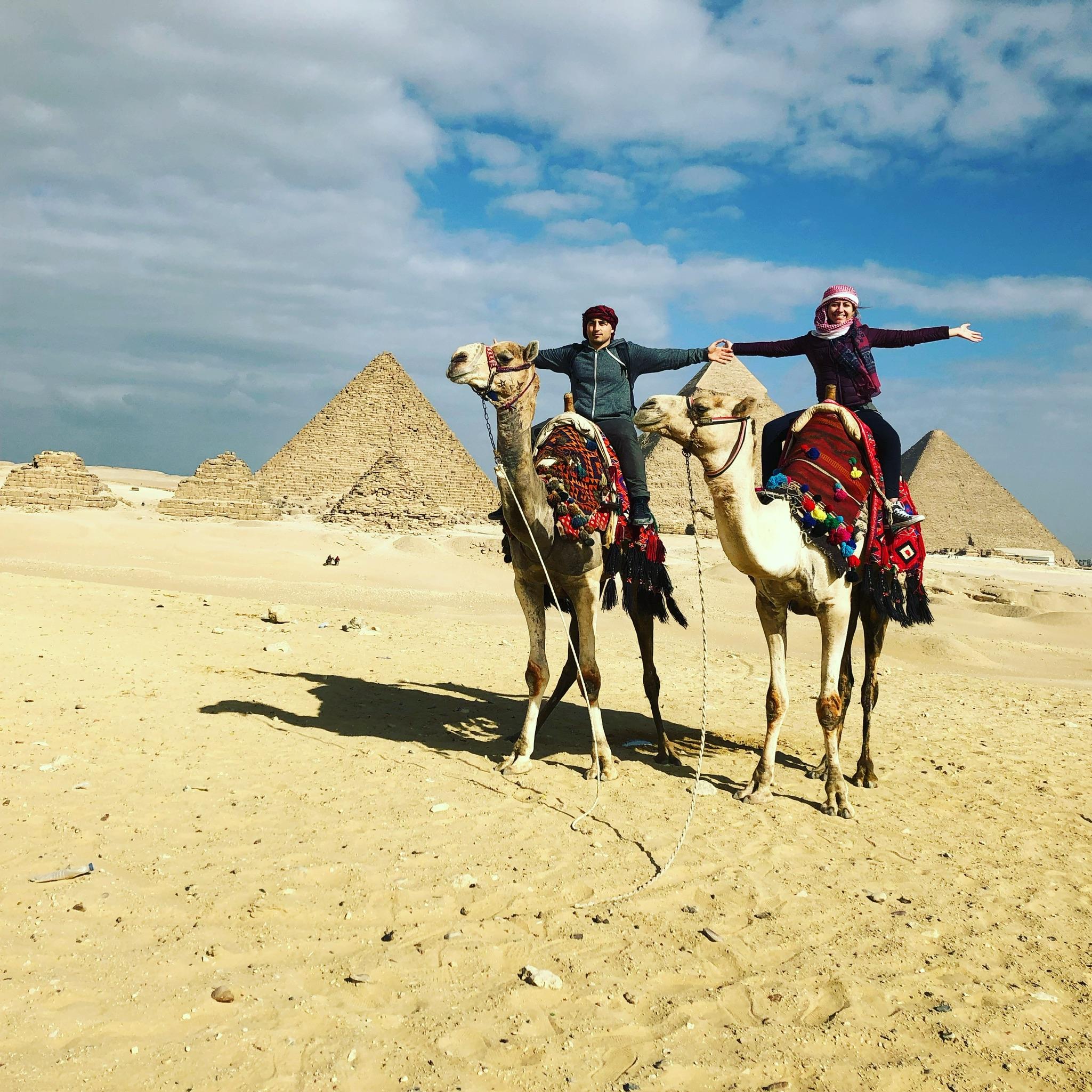 Riding camels near the Great Pyramids of Giza in Egypt 2018