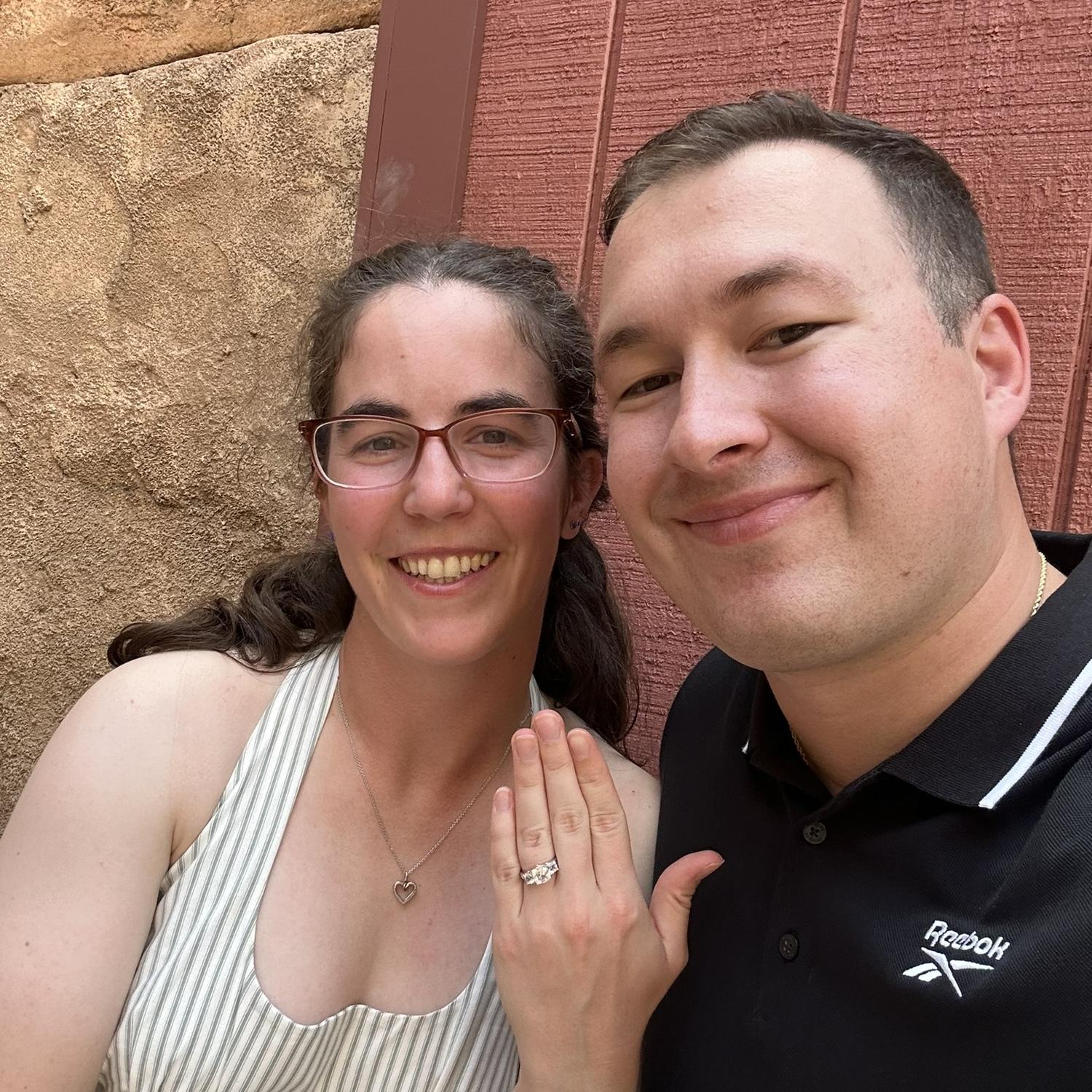 The photo we sent our families after Dylan proposed in front of the Hogwarts Castle in Universal!