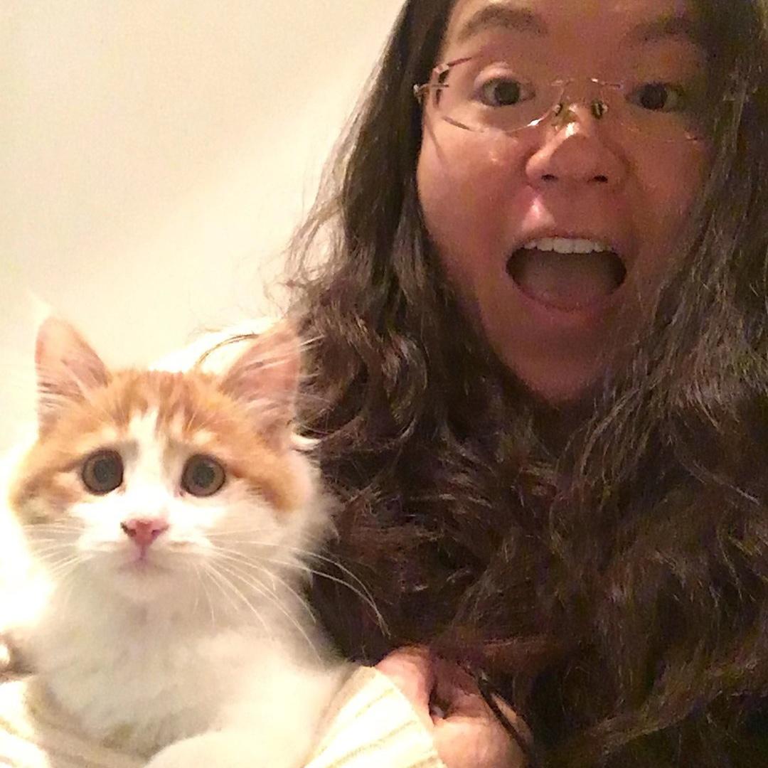 Before coming to Texas, Nina had a orange tabby cat named Shalom! She left the cat at home since it was difficult to take Shalom across the ocean.