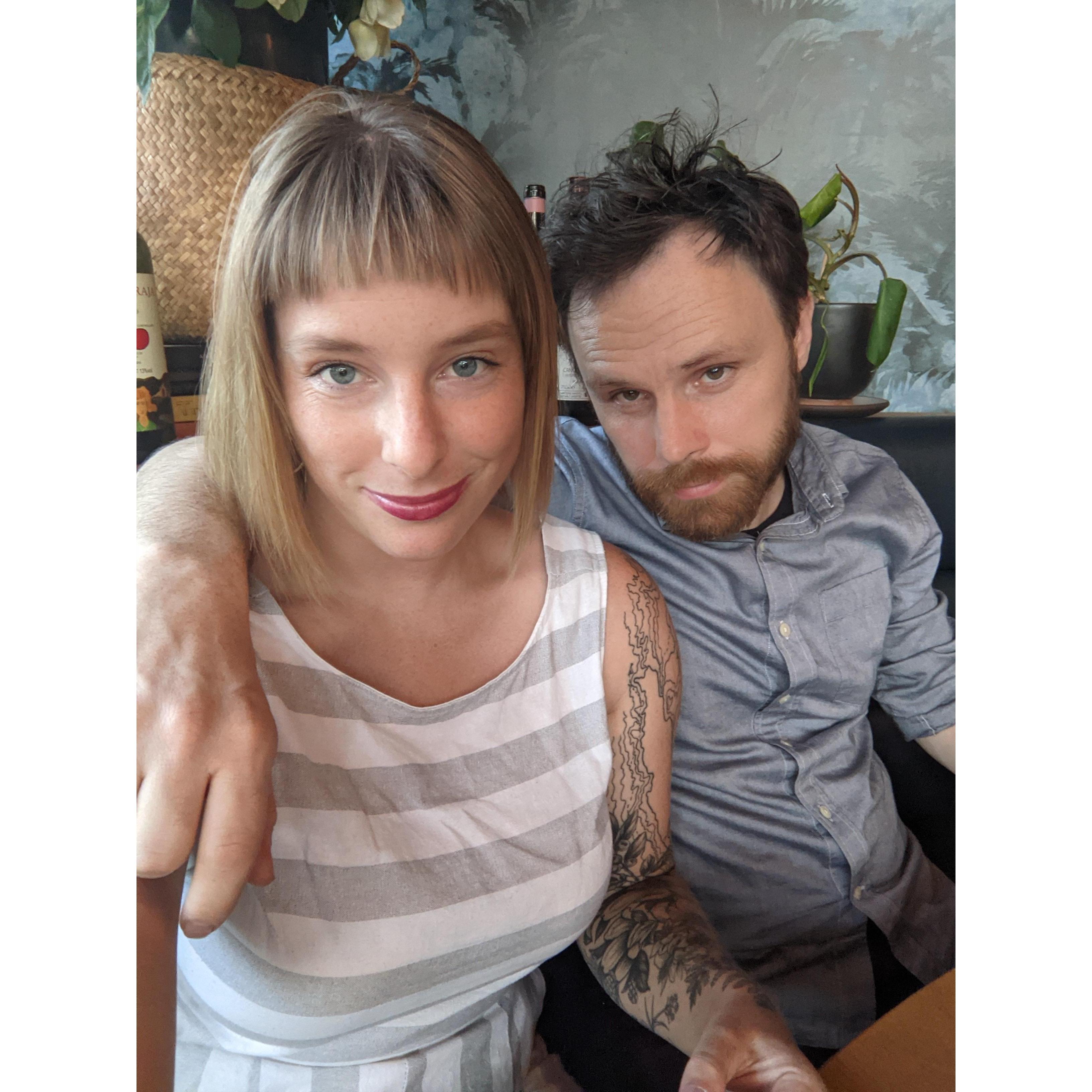 At one of our favorite places, Dame, celebrating our engagement.