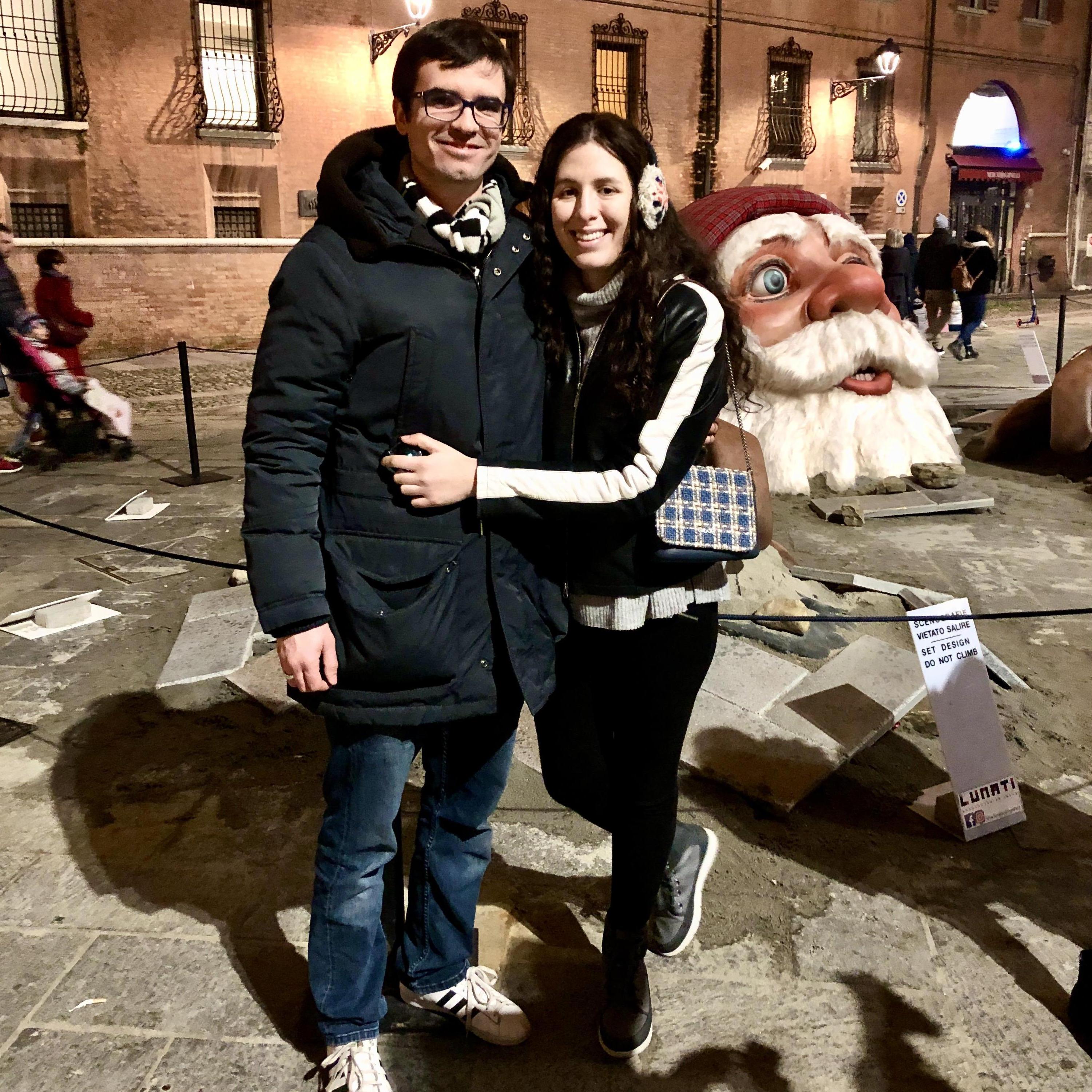 December 2019: After torta fritta, we took a walk to see a giant Santa clawing his way out of the ground in Modena