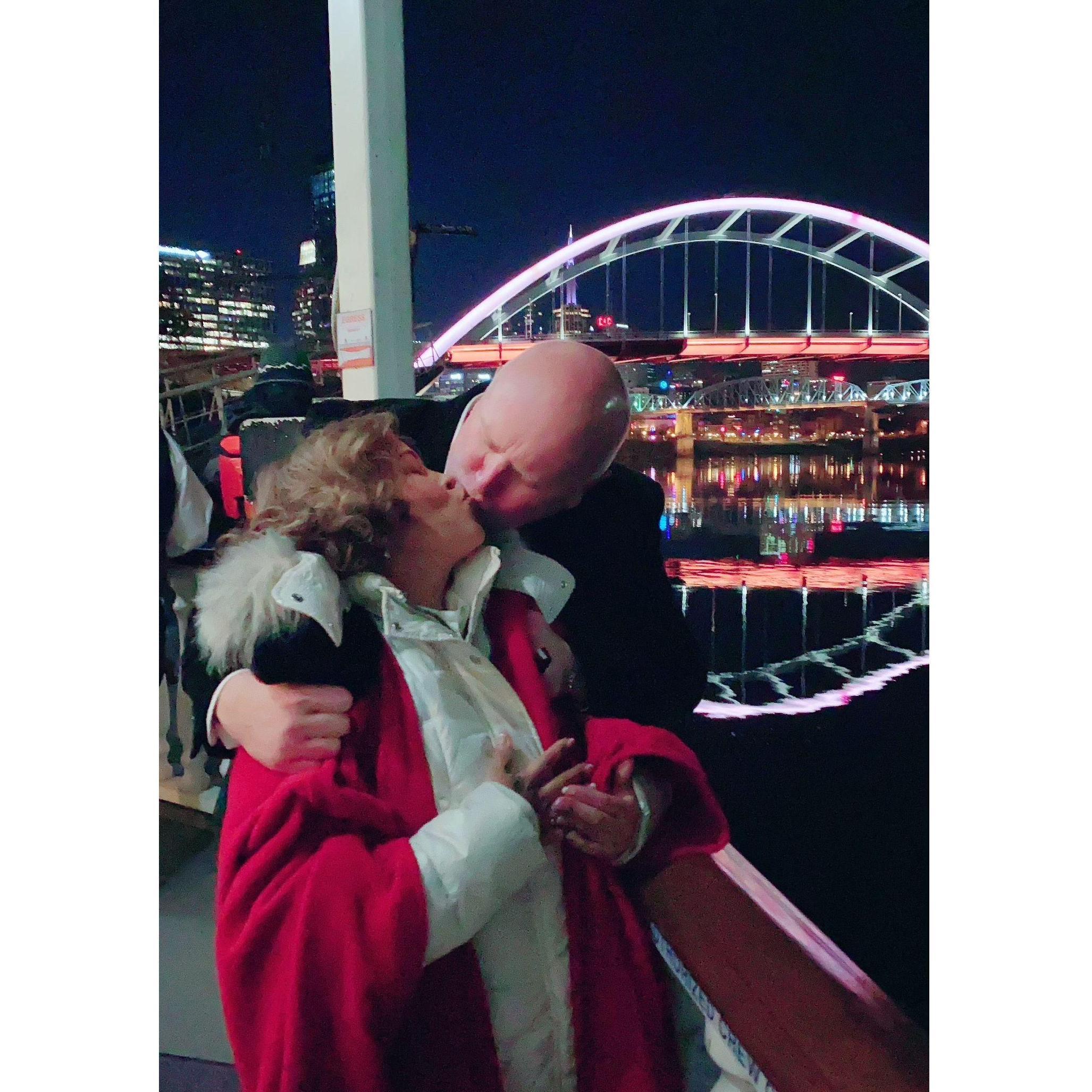 Dinner cruise downtown with friends and sneaking a kiss.