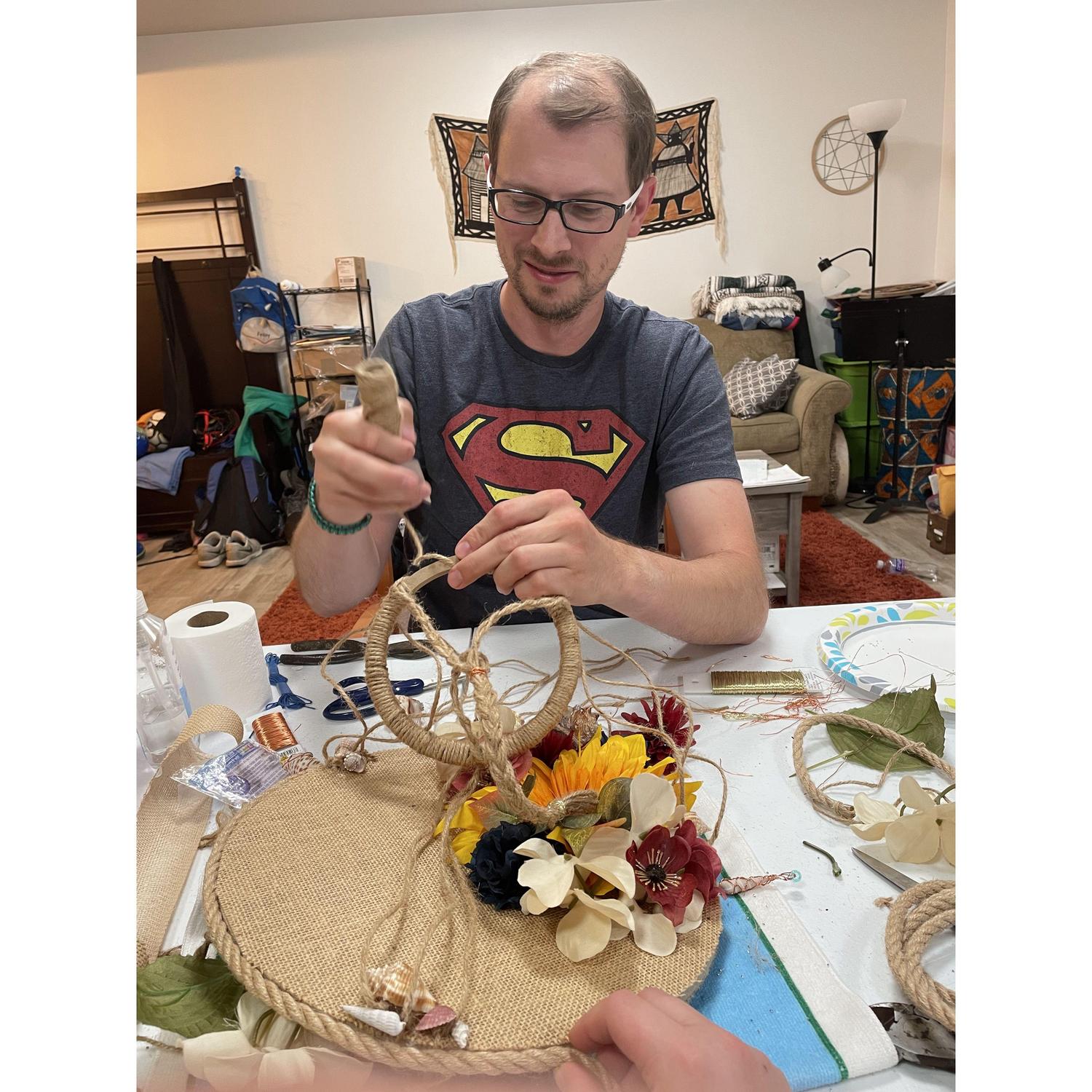 Adam hard at work, helping me make a mobile for Larissa's little one.