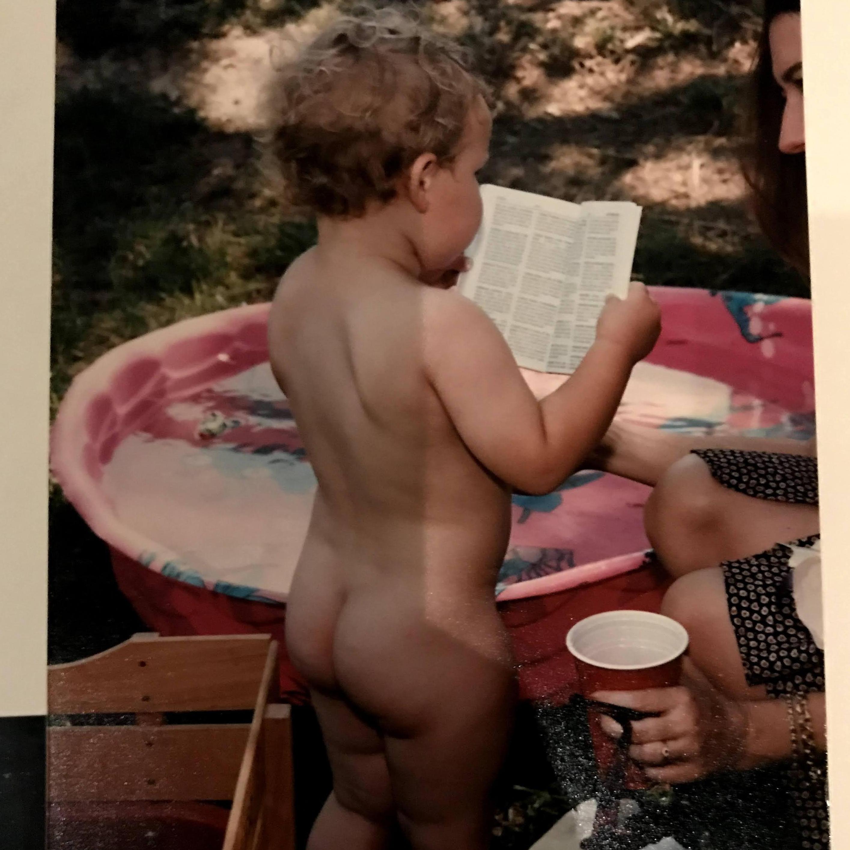 a baby bride seen here reading the Bible, butt naked, someone else holding her drink (similar scenes expected on the wedding day)