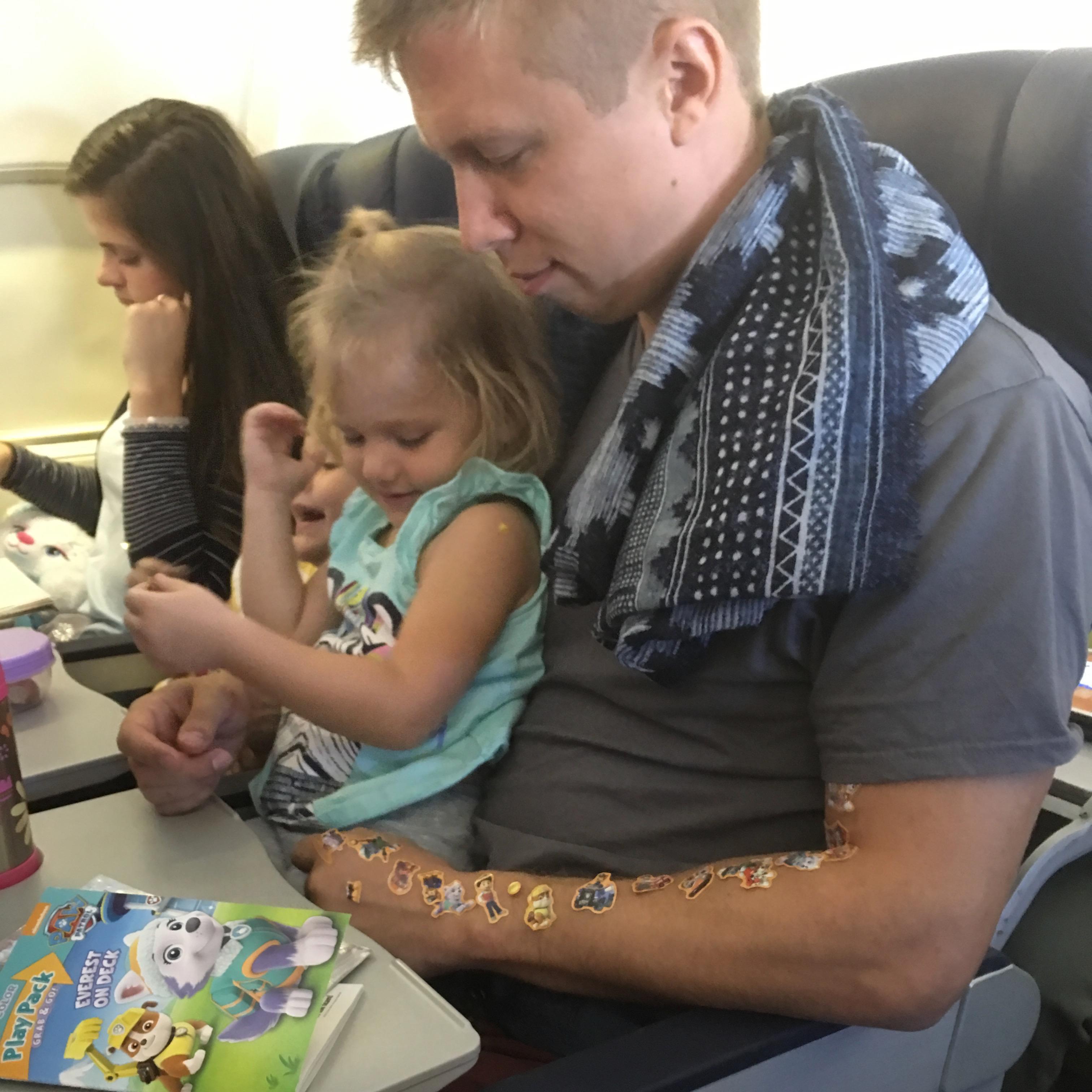 Melissa's nieces ADORE Jess! How could you not when he wears a scarf and lets you cover him in stickers on the plane?!