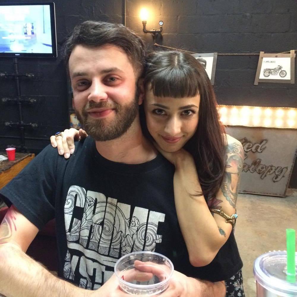 One of our first official photos taken together. At a work event before Clovermint Cafe was open.